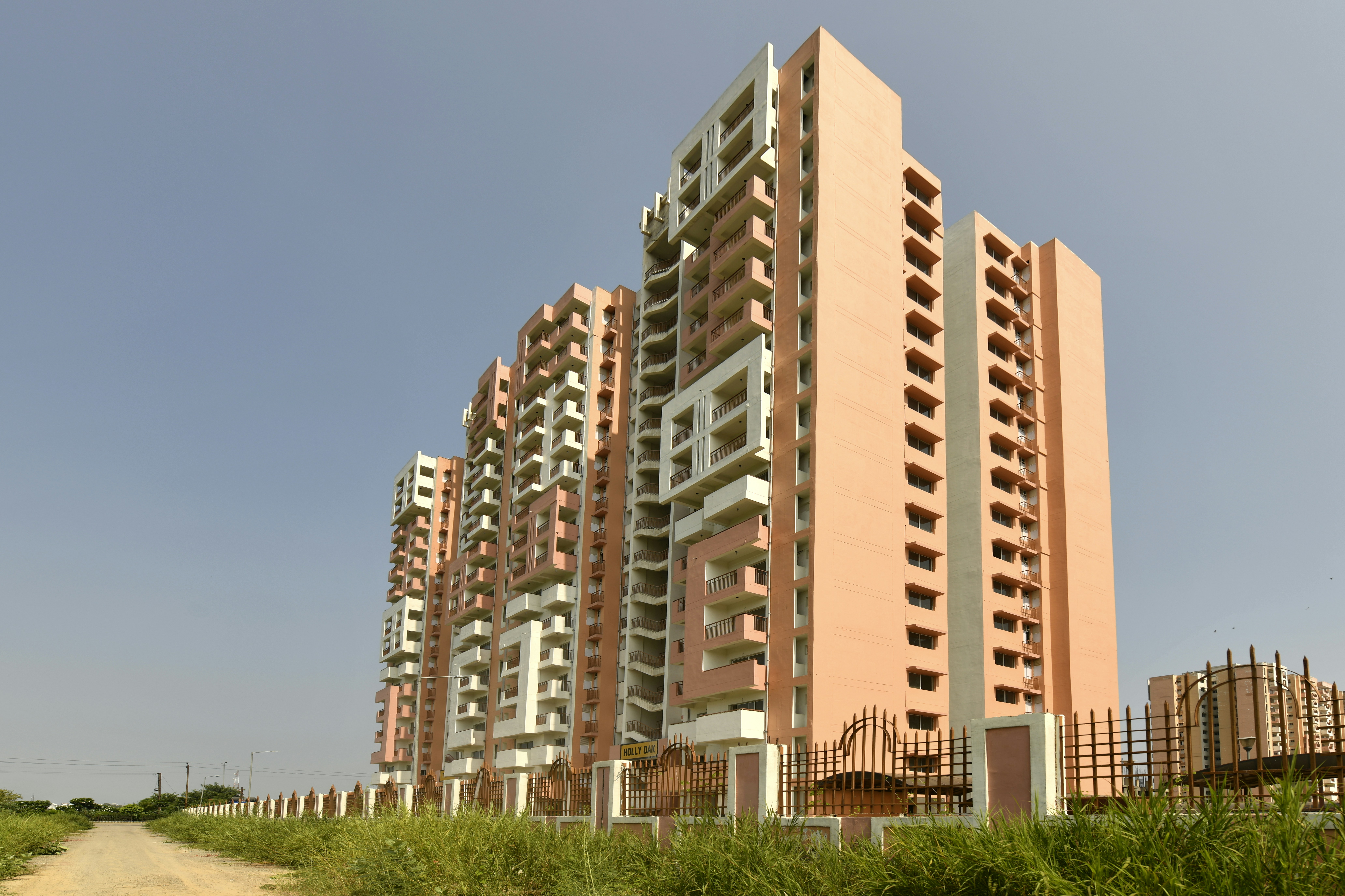 Tall apartment buildings under a clear blue sky