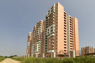 Tall apartment buildings under a clear blue sky