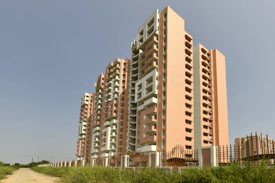 Tall apartment buildings under a clear blue sky