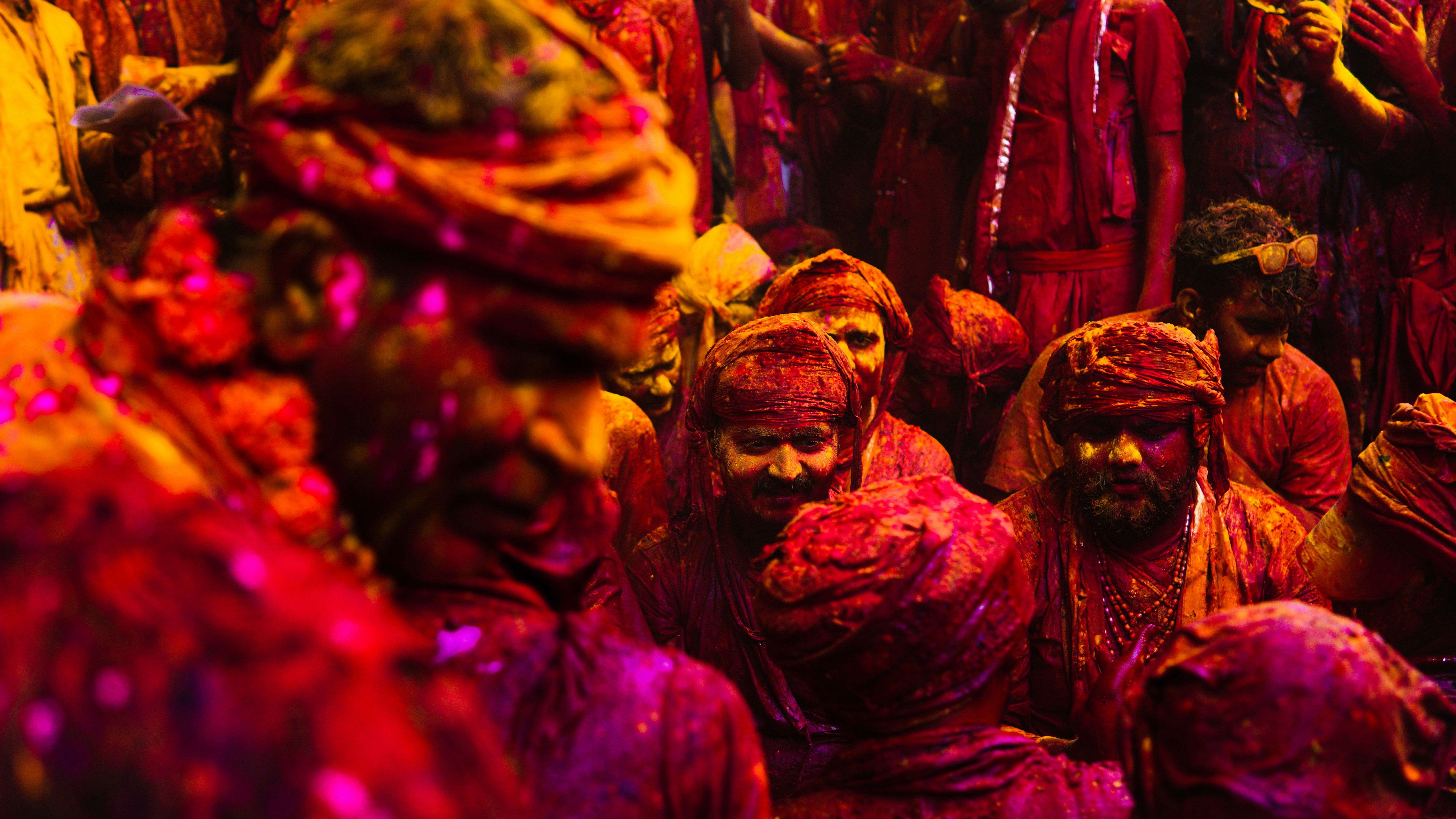 People covered in colorful powder during a festival