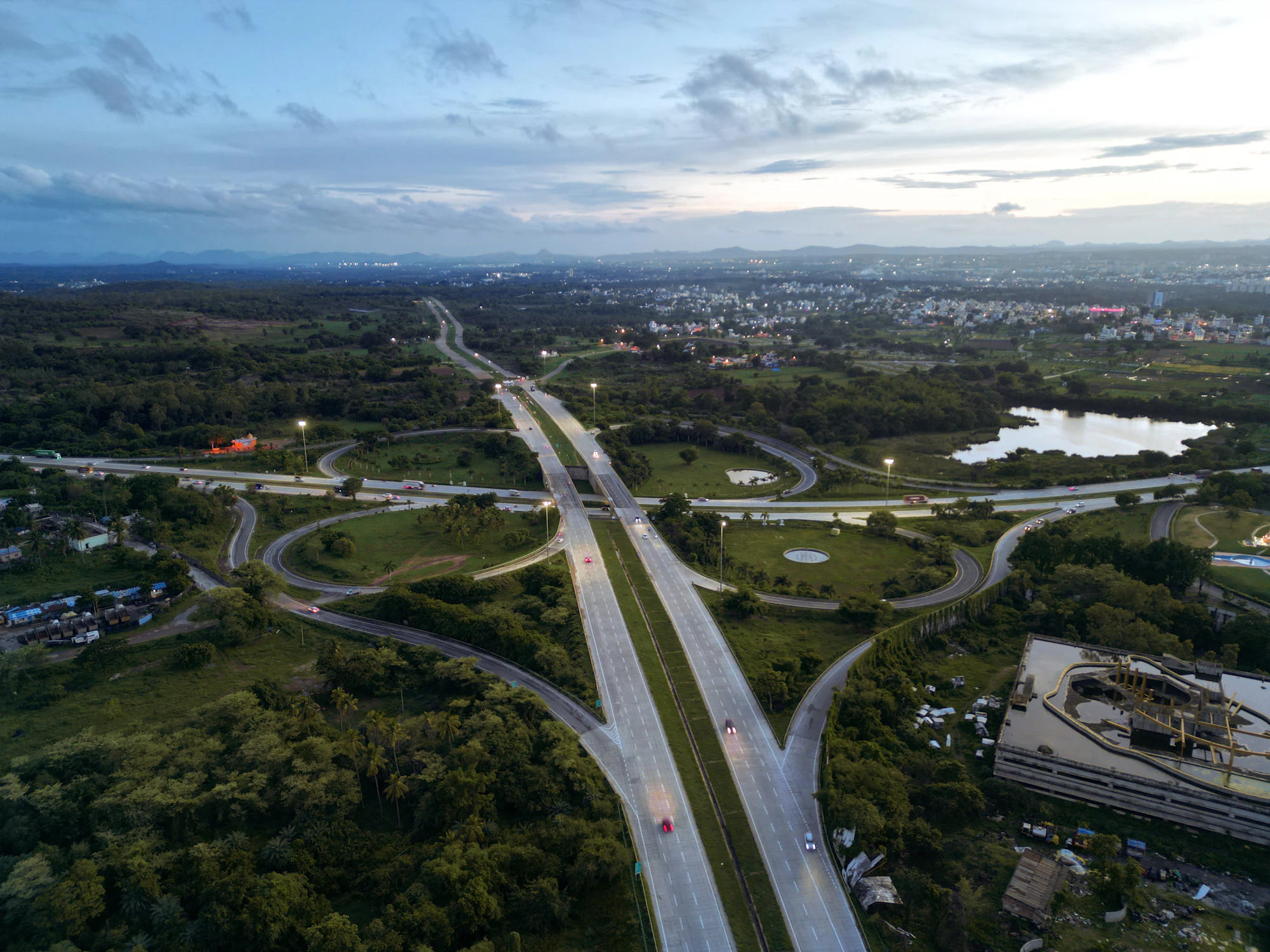 Aerial view of a multi-level highway interchange at dusk