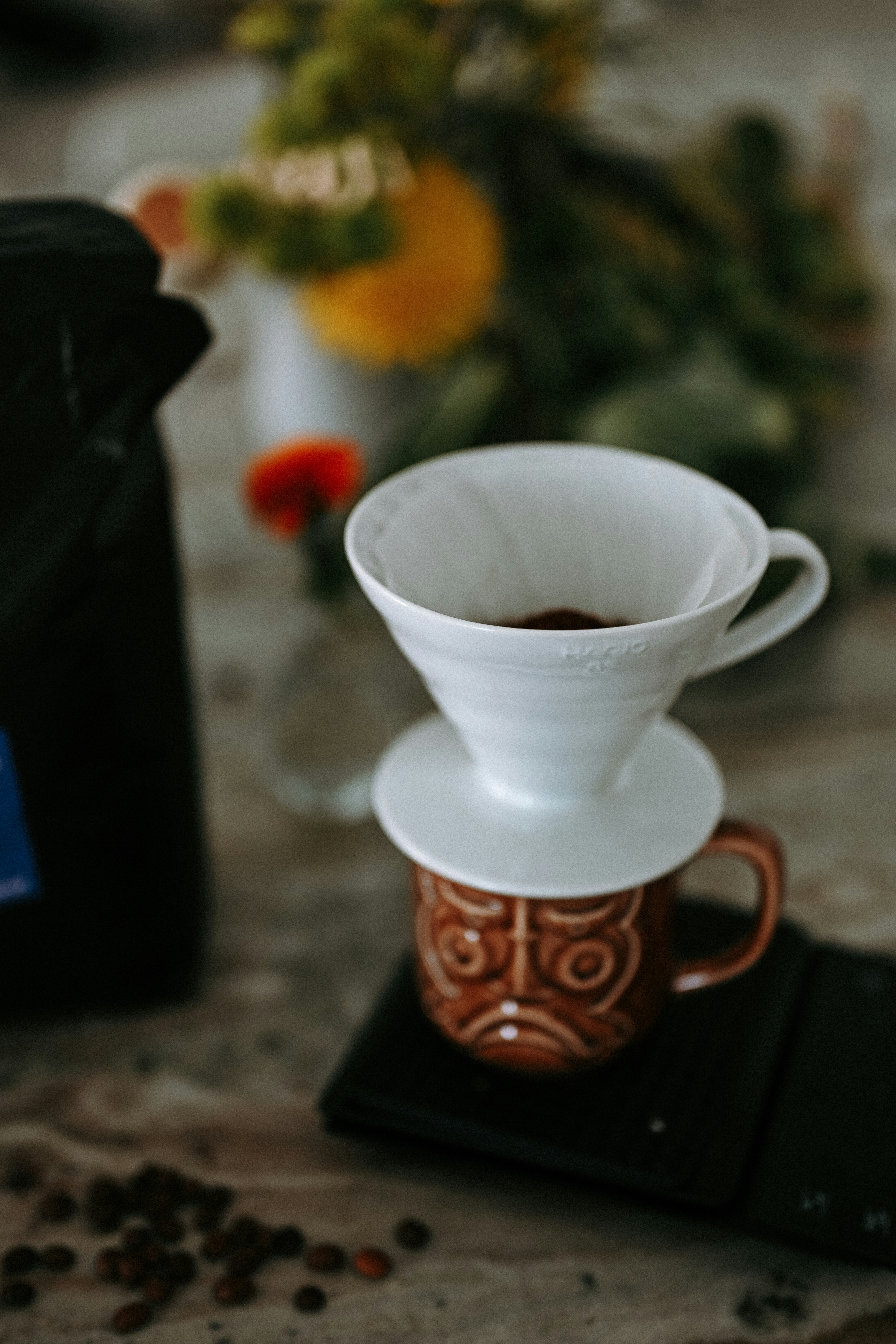 Pour-over coffee brewing with a tiki mug