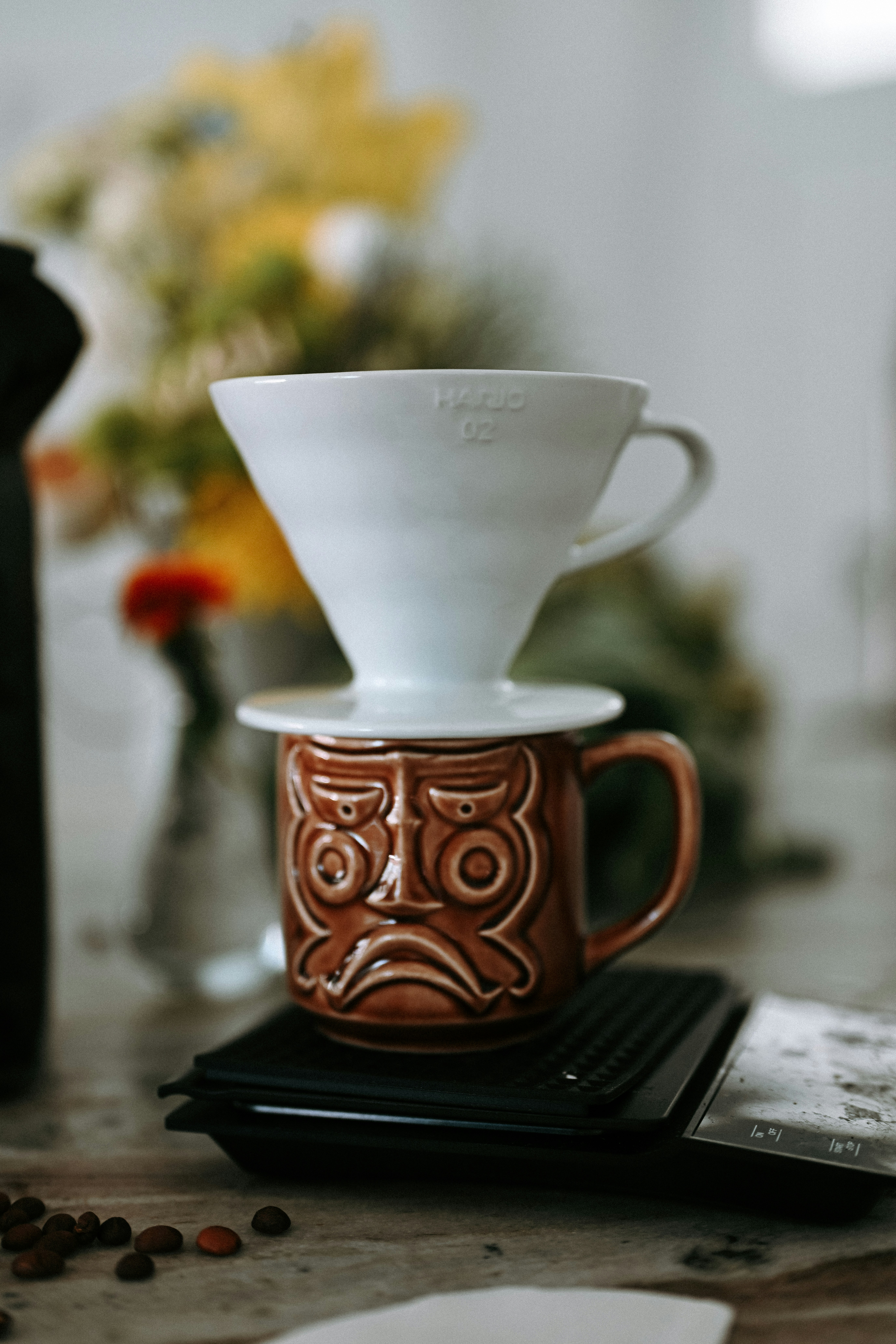 Coffee pour-over setup with a tiki mug.