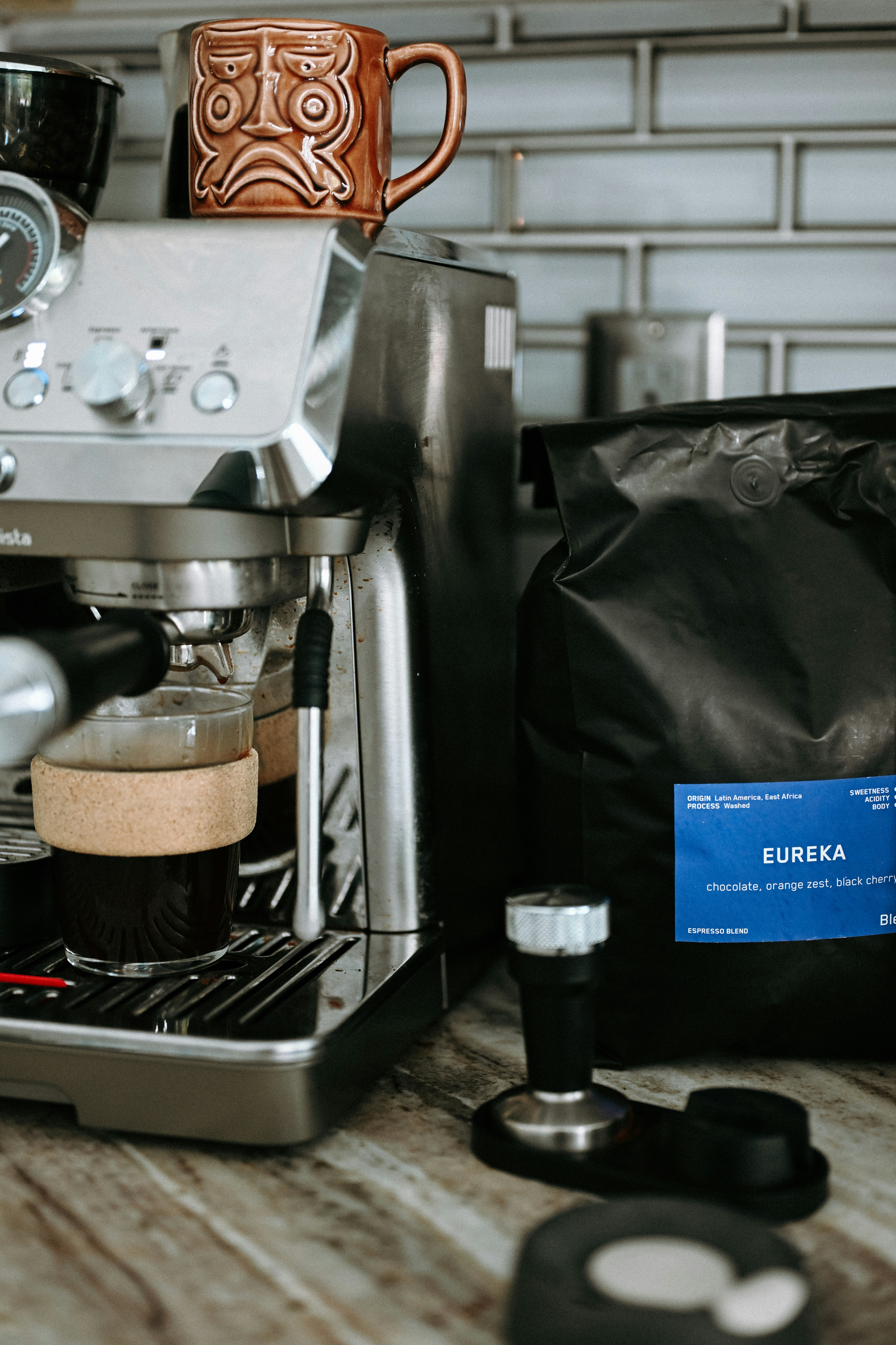 Espresso machine with coffee beans and tamper