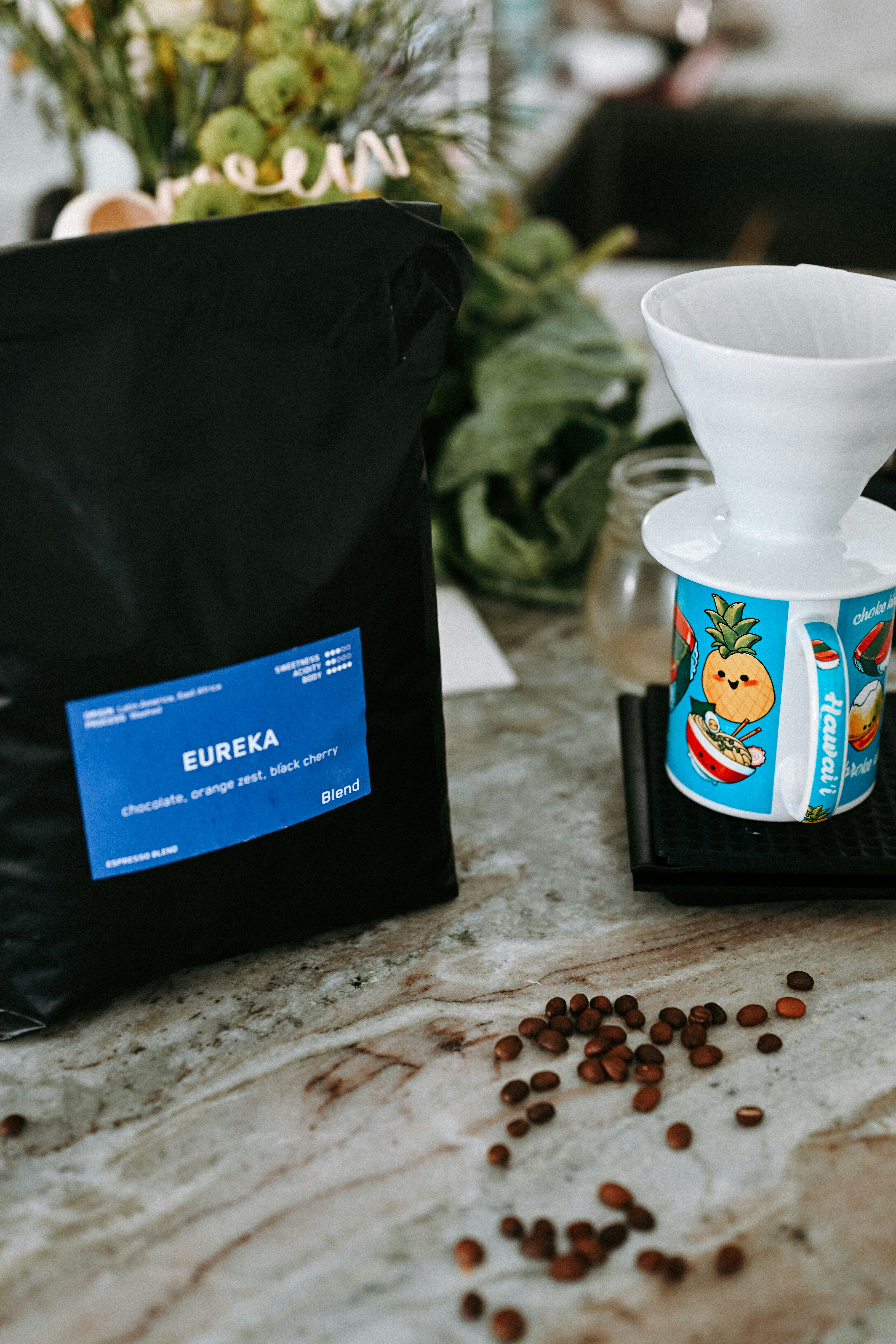 Bag of eureka coffee beans with brewing equipment