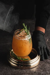 A smoky cocktail with rosemary and ice