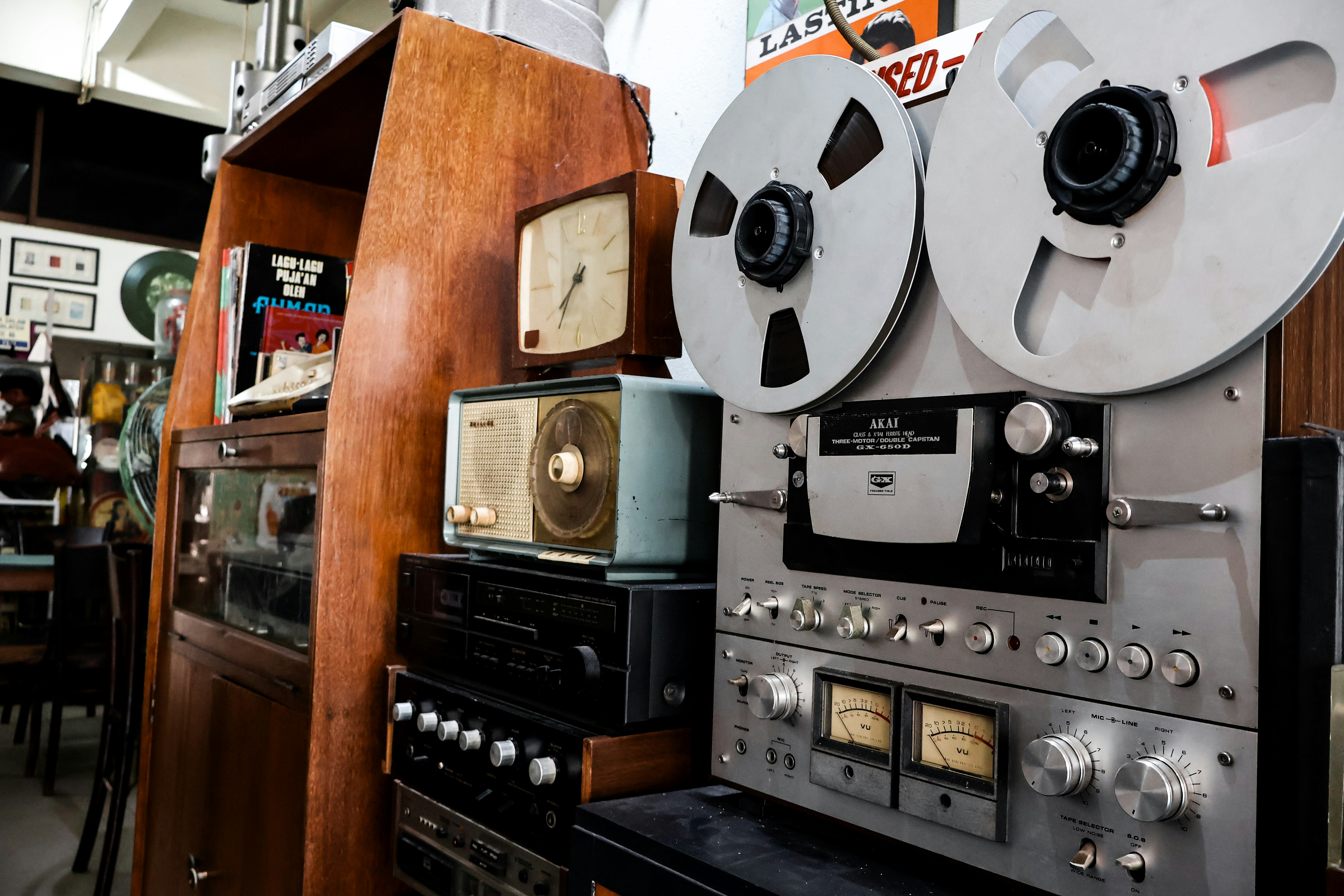 Vintage reel-to-reel tape recorder and audio equipment