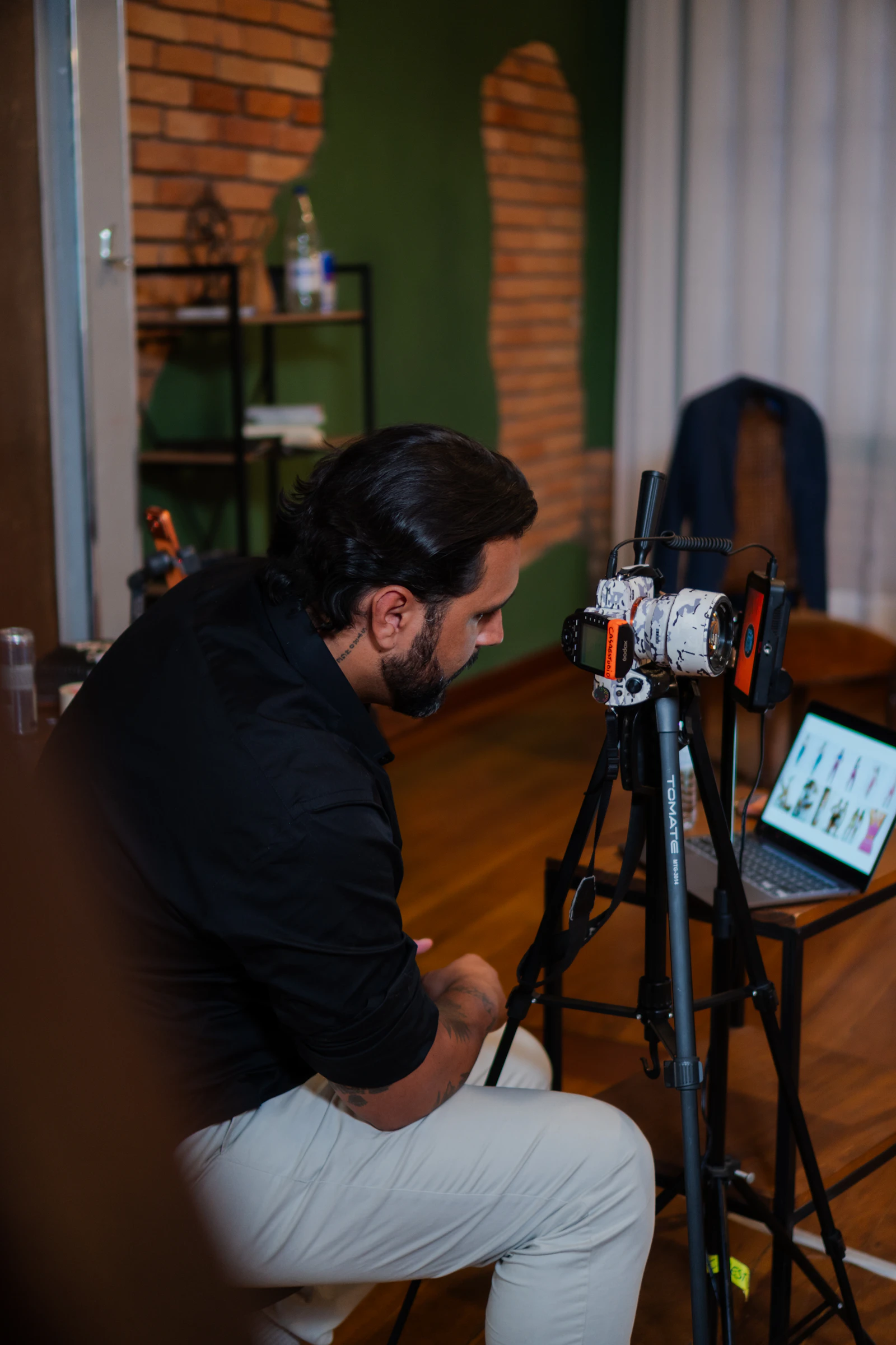 A creator filming with a camera on a professional setup.