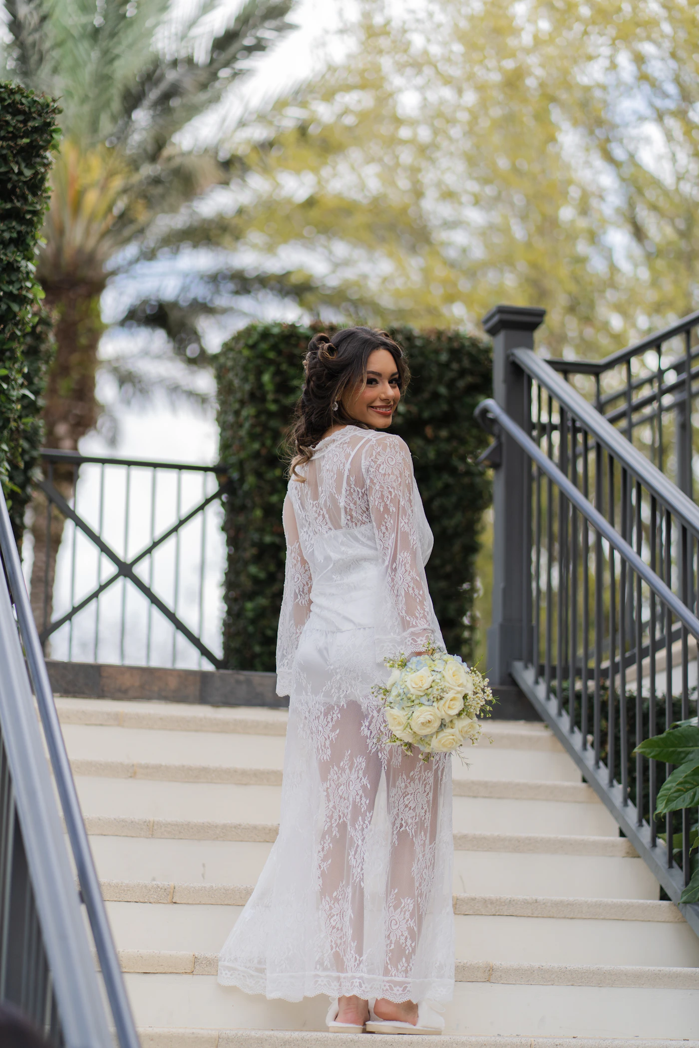 Best lace wedding dresses for summer outdoor ceremonies — Close-up of soft floral lace appliqués on a summer wedding dress sleeve.