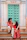 Couple in traditional indian attire sitting on steps.