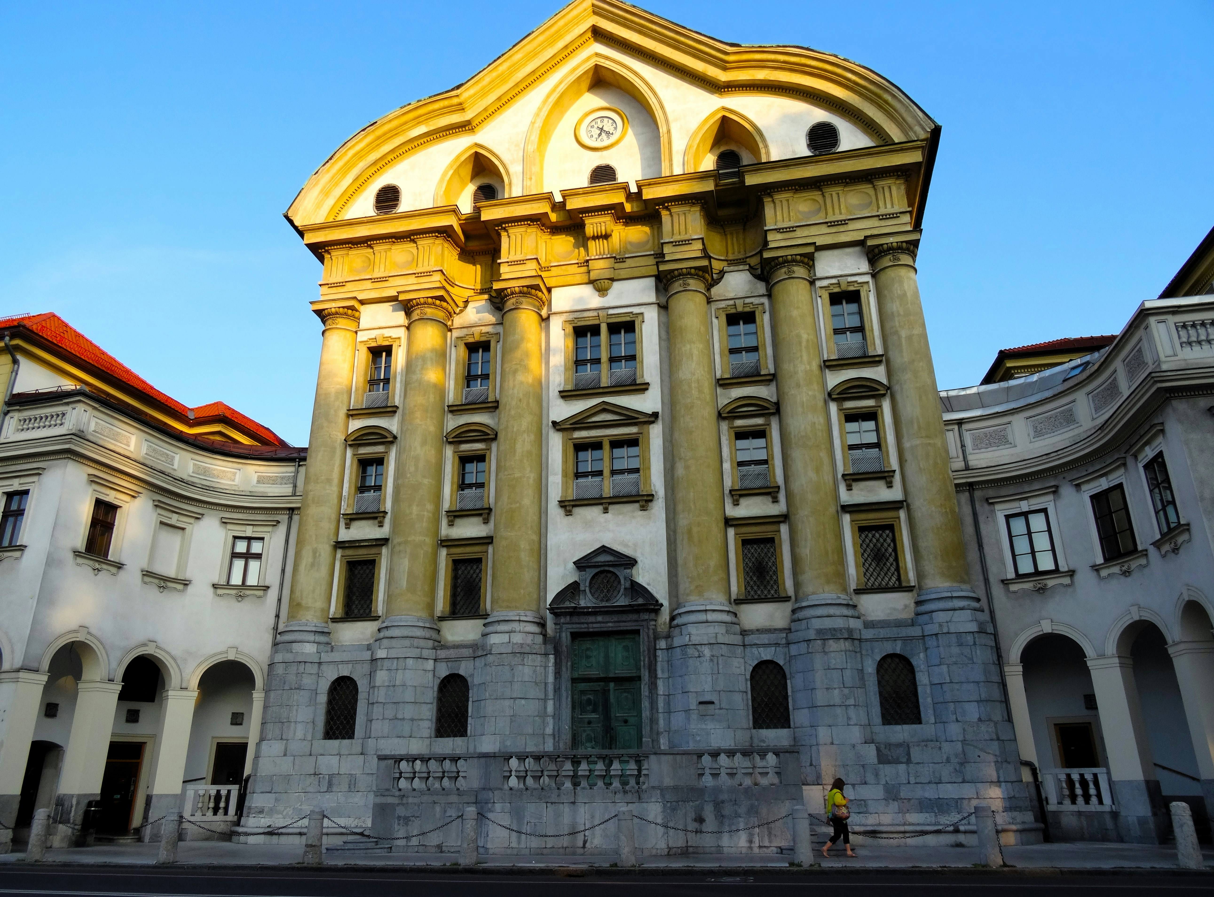 Ornate building with classical architecture under a clear sky.