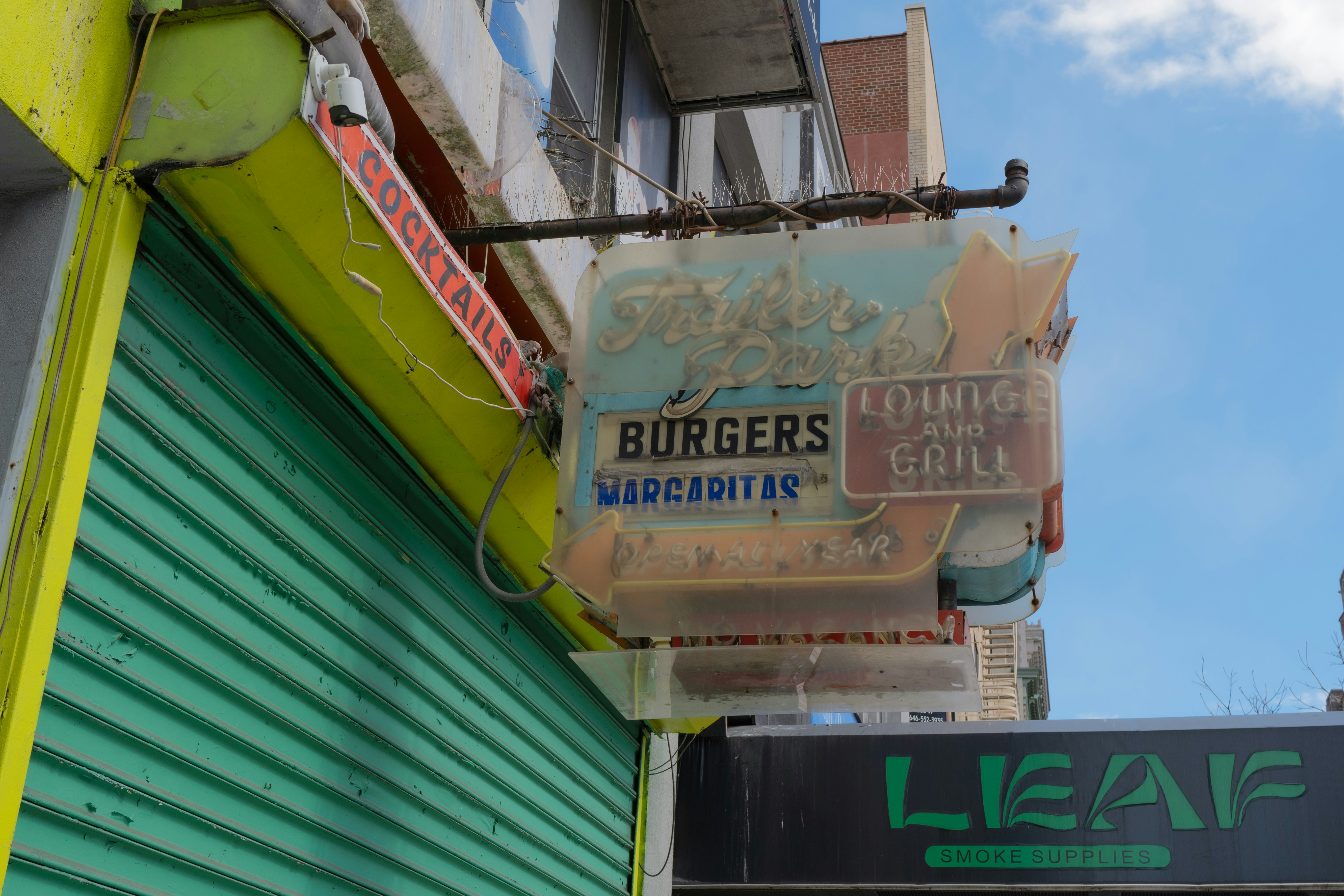 A vintage burgers and grill sign on a building. photo – Free Neon sign ...