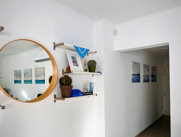 Hallway with a round wall mirror