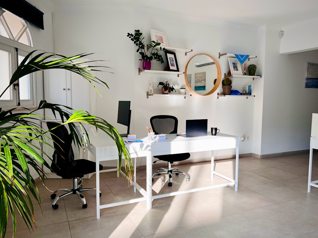 A bright, clean office interior with modern furniture A bright, clean office interior with modern furniture