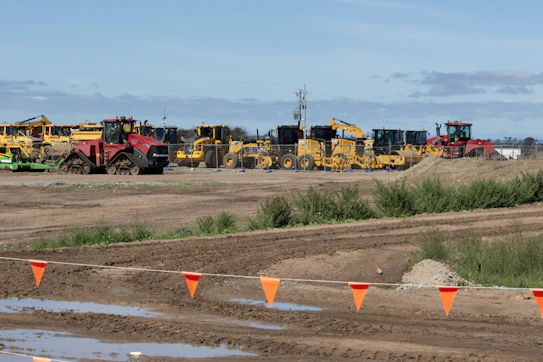 Construction equipment parked in a field