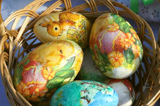Decorated easter eggs in a woven basket