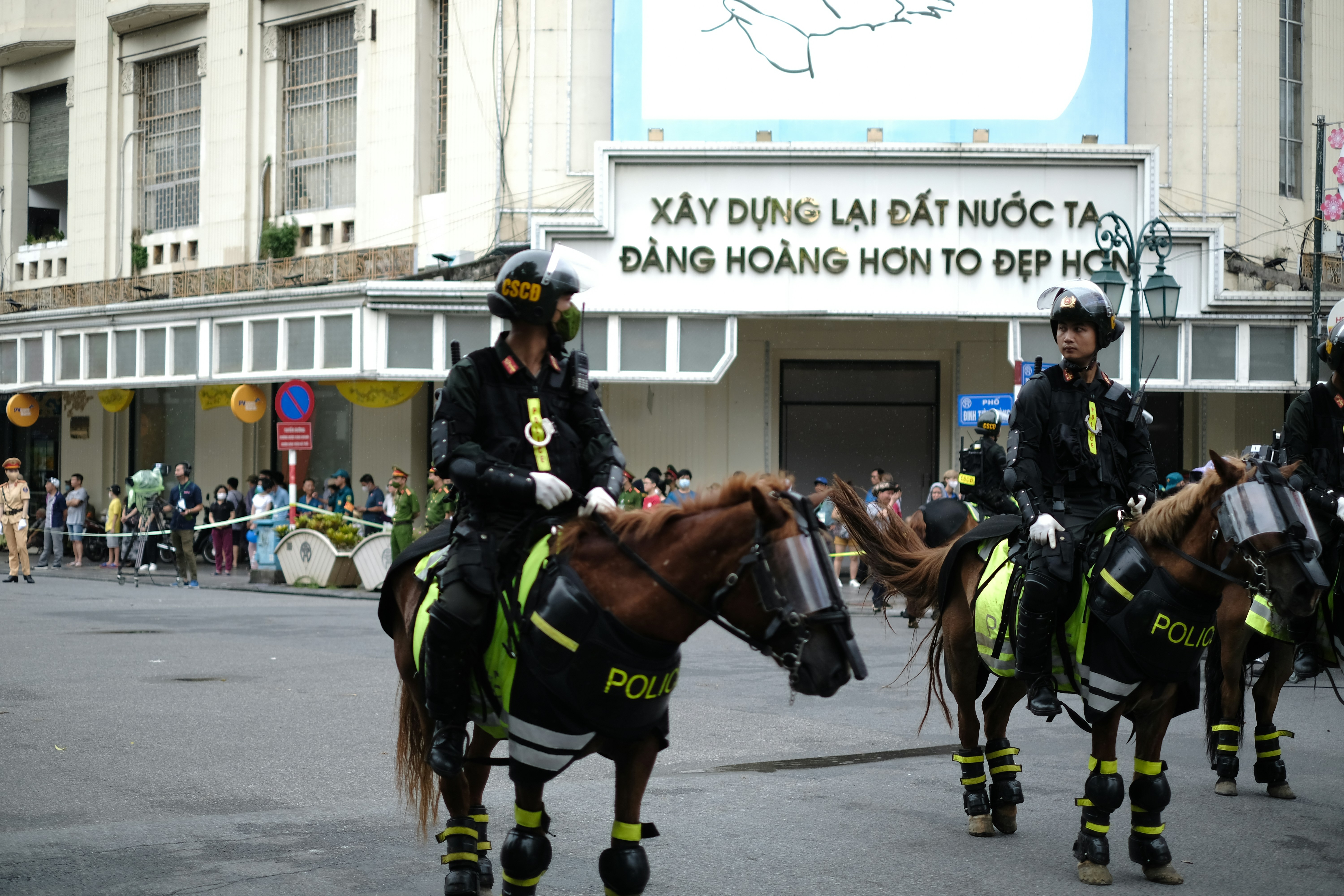 Mounted police officers in uniform riding horses