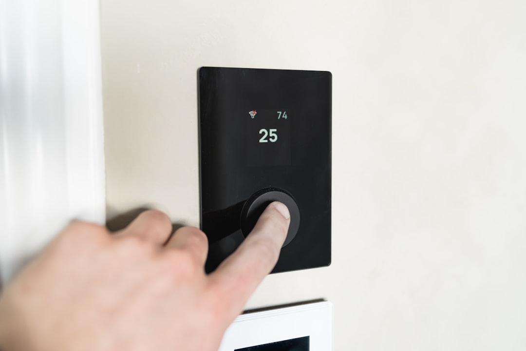 Modern smart thermostat interface on a clean home wall - what over 45 years of miami hvac experience means Modern smart thermostat interface on a clean home wall - what over 45 years of miami hvac experience means