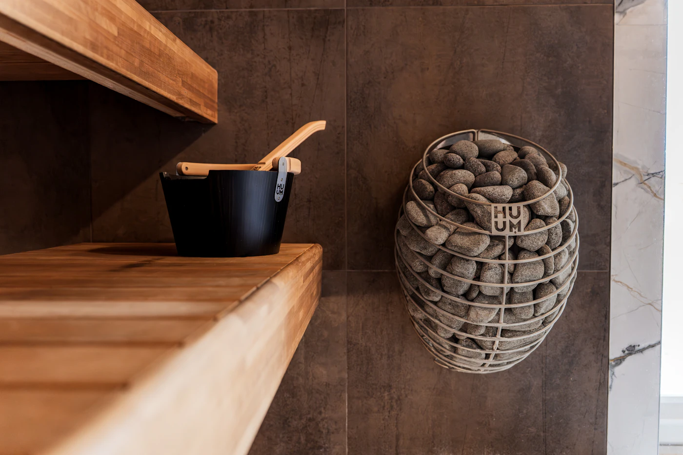 Sauna heater stones and wooden bucket