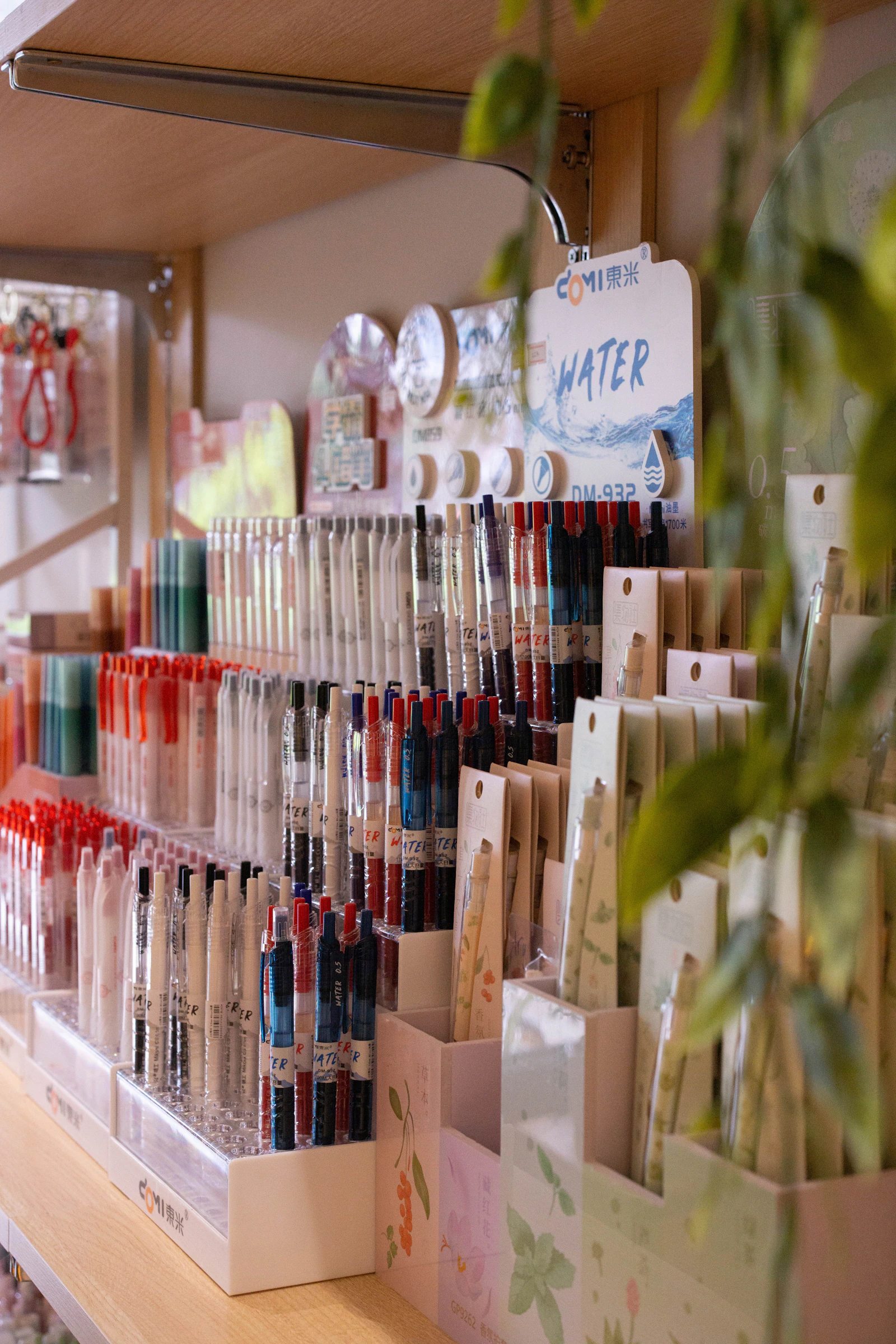 Stationery and school supplies stacked on the shelves of a small shop