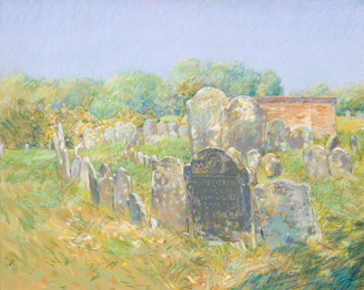 Old gravestones in a historic cemetery with trees.