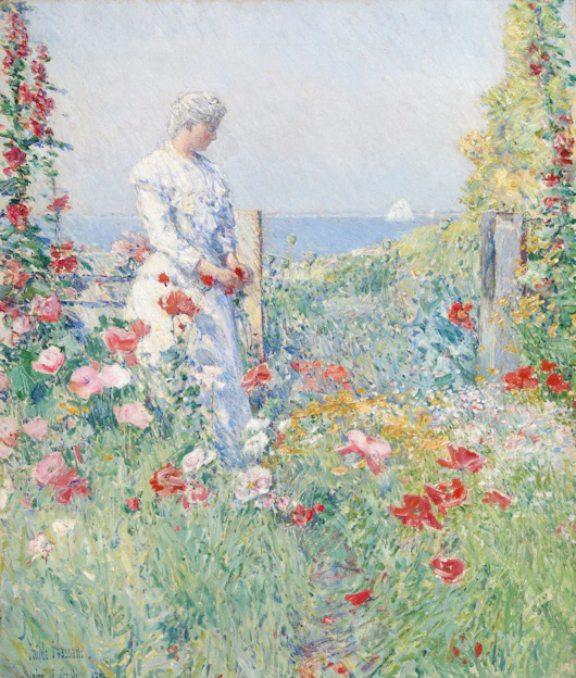 Woman in a white dress in a flower garden
