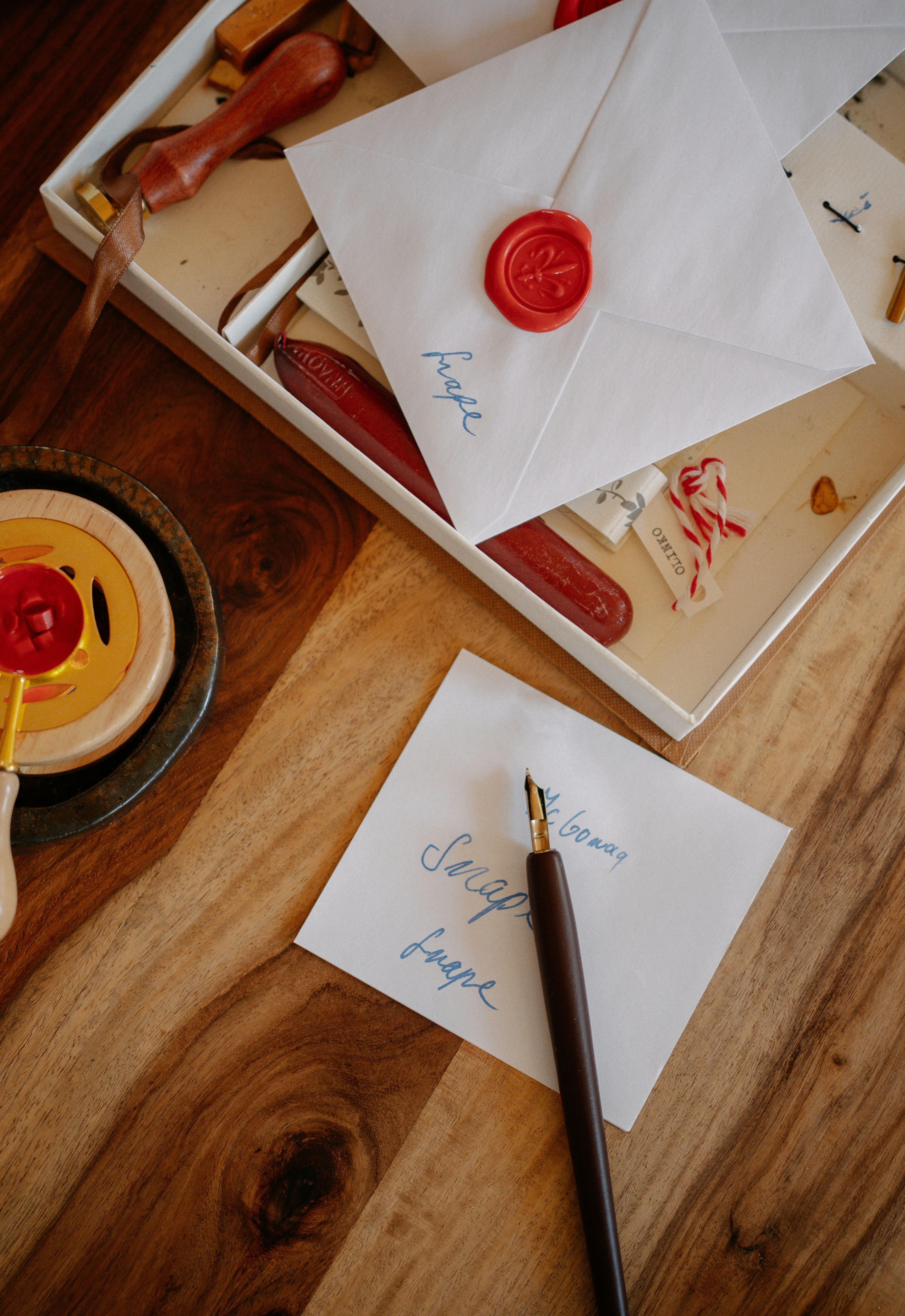 Envelopes with wax seals and a quill pen.