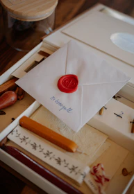 Sealed letter with wax seal and calligraphy supplies.