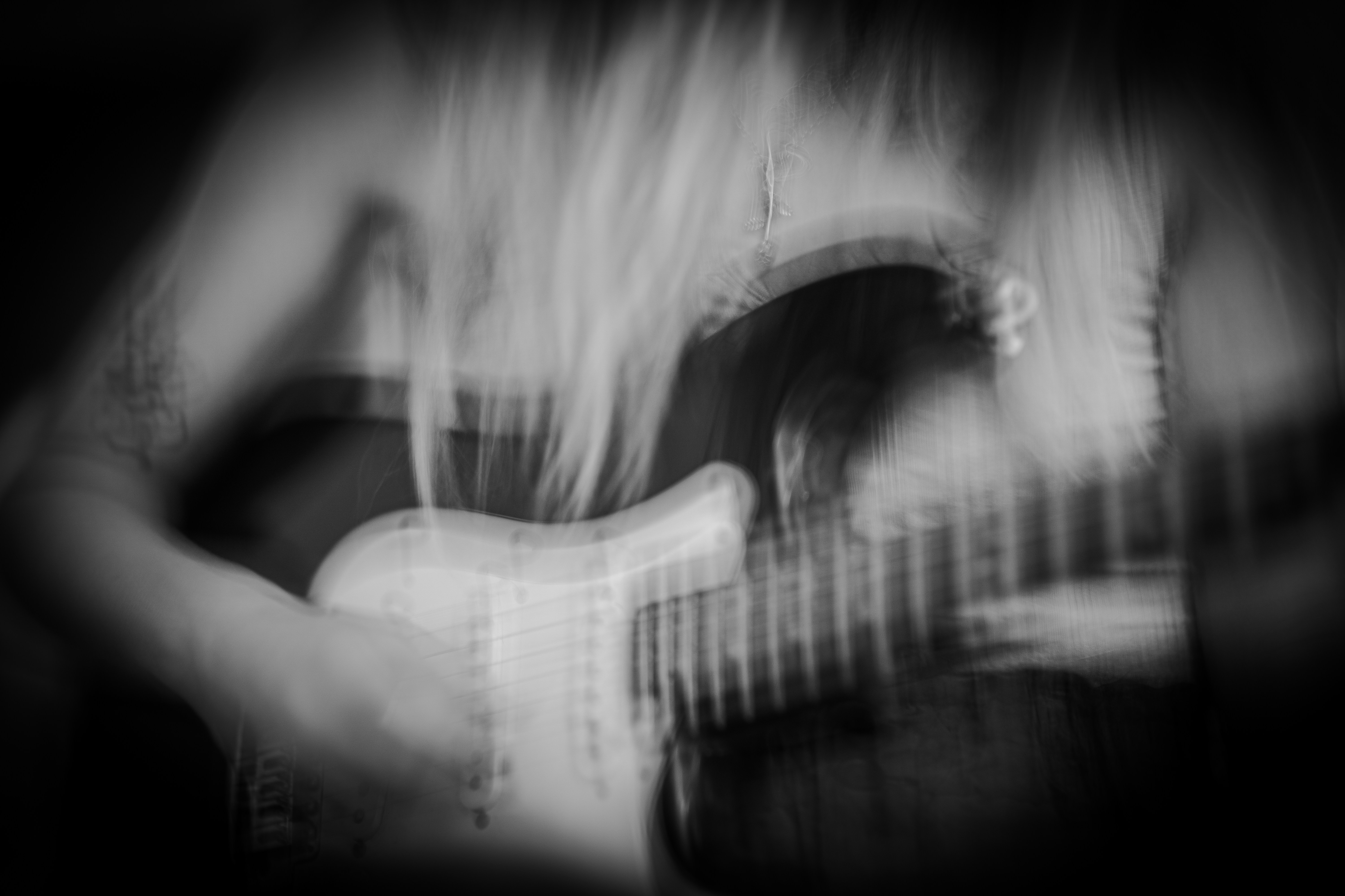 J. Rose playing guitar