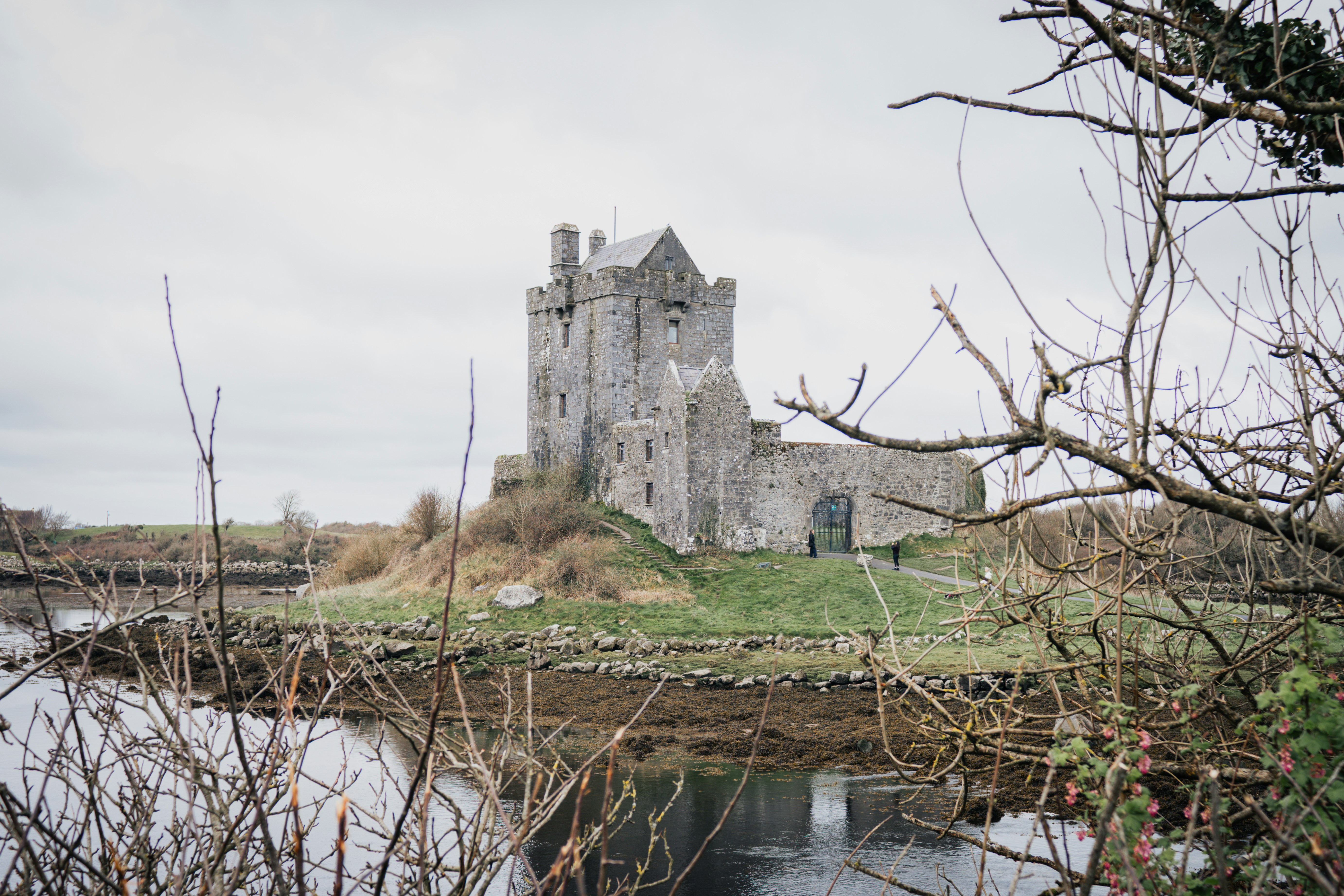 Stone castle on a small island surrounded by water. photo – Free ...