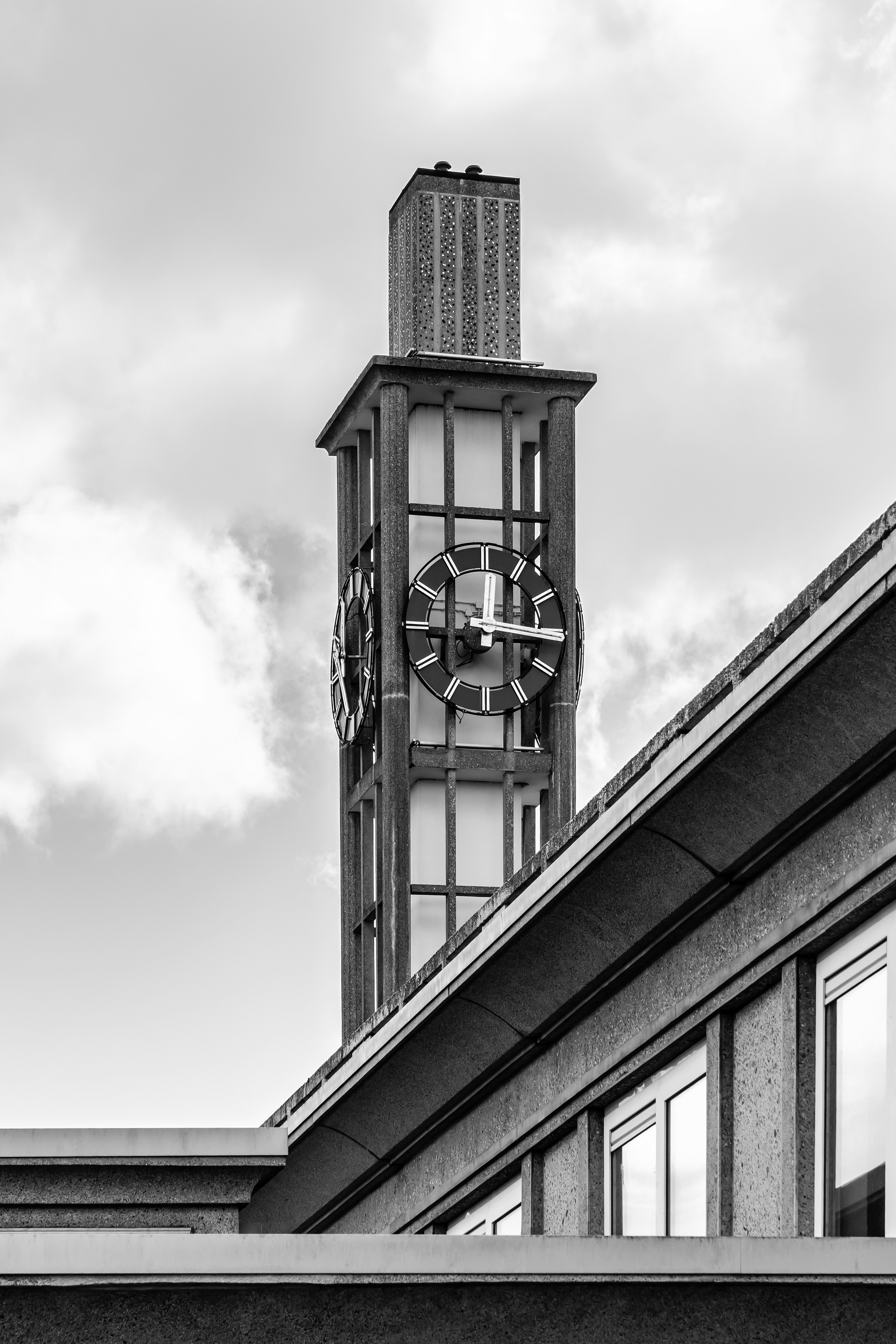 A black and white view of a clock tower