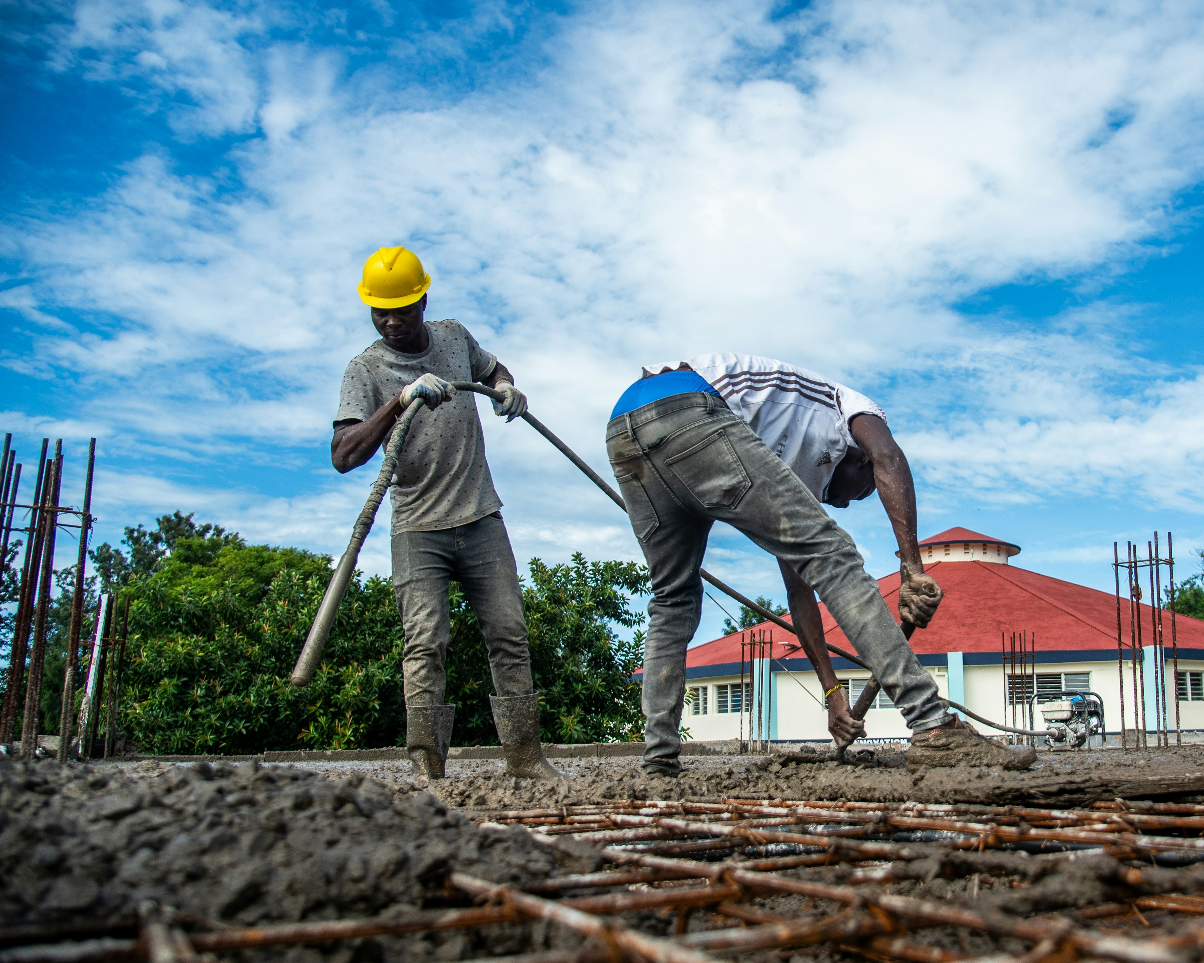 Worker standing on a hard concrete surface in heavy boots - high arch work boot insoles