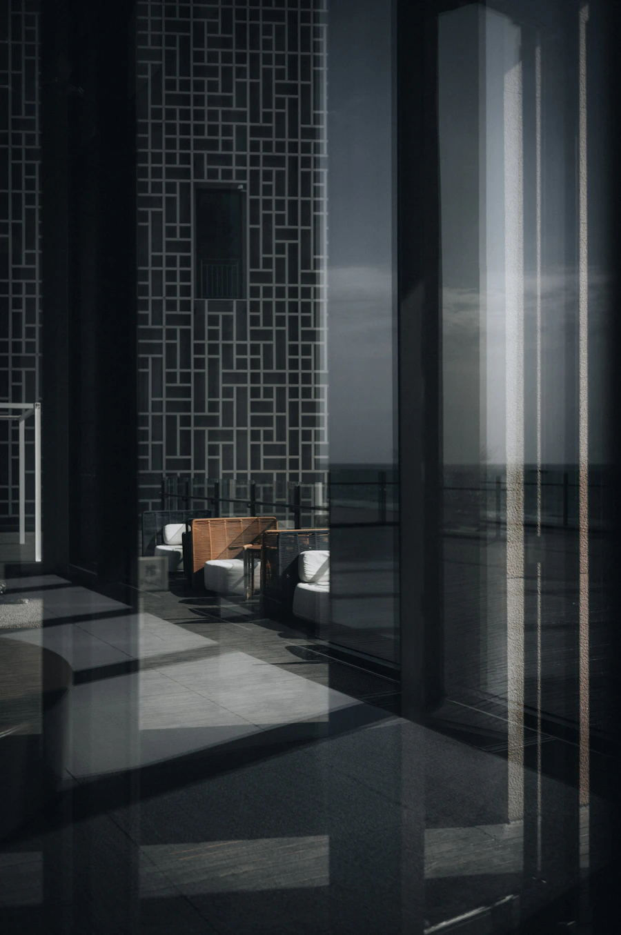 A sunlit seaside lounge with a broad view of the horizon