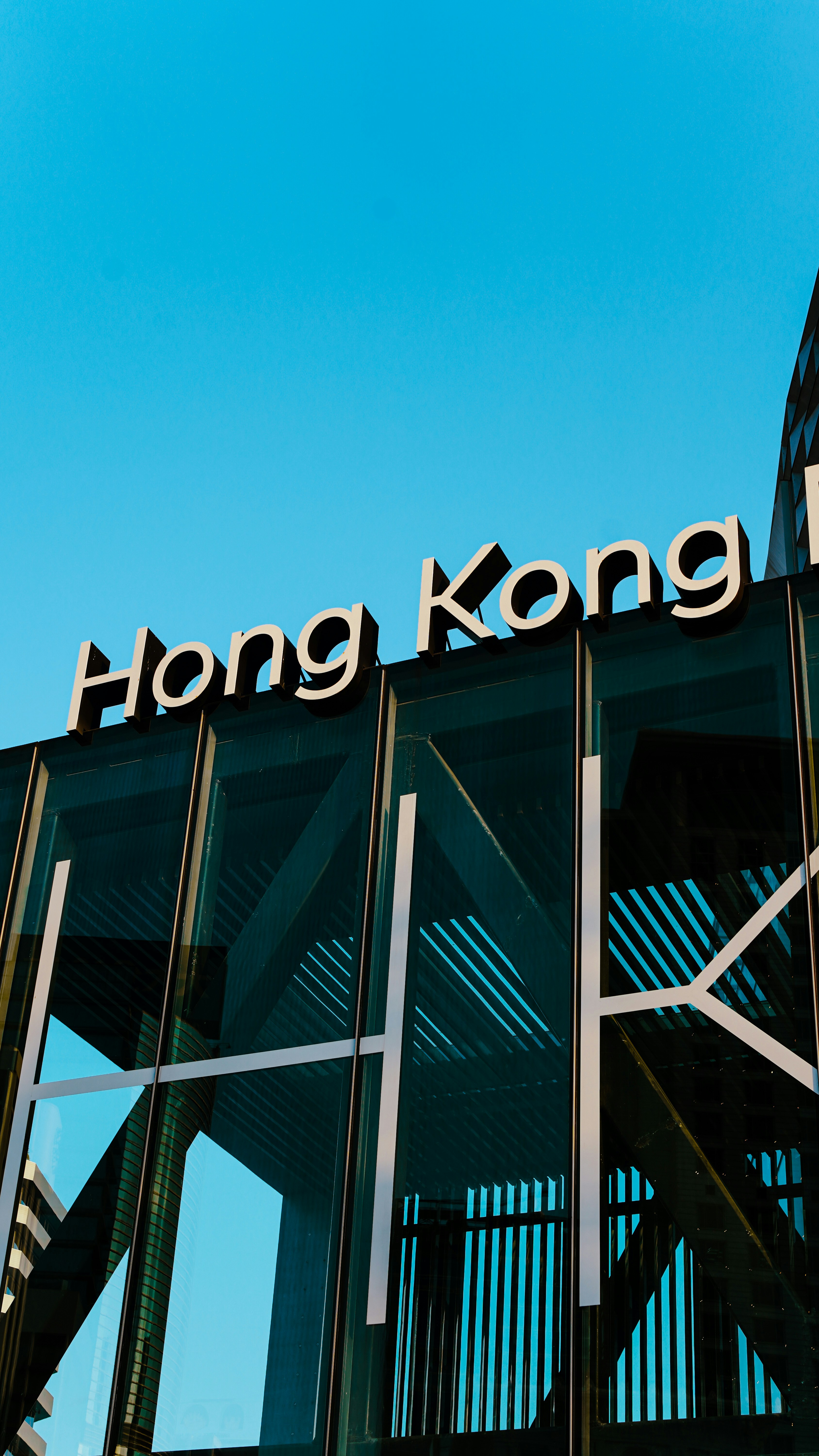 Hong kong sign on modern building facade