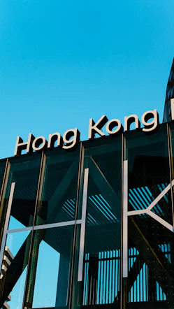 Hong kong sign on modern building facade