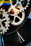 Close-up of intricate clockwork gears and roman numerals