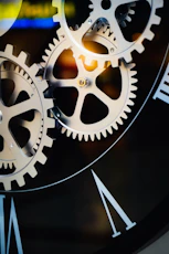 Close-up of intricate clockwork gears and roman numerals