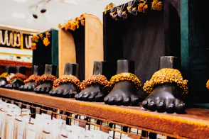 Row of decorative feet displays in a store.