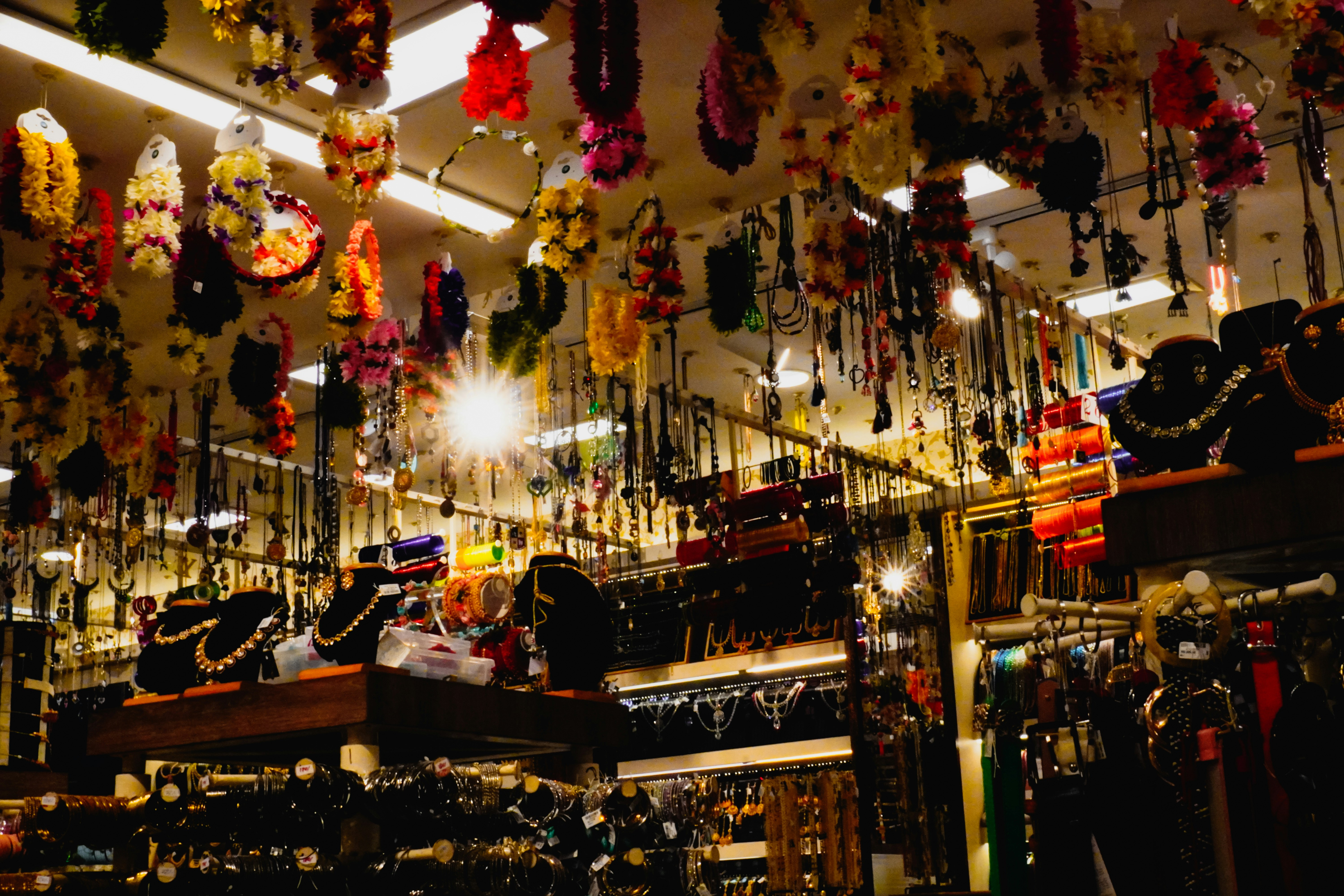 Colorful necklaces and jewelry displayed in a store.