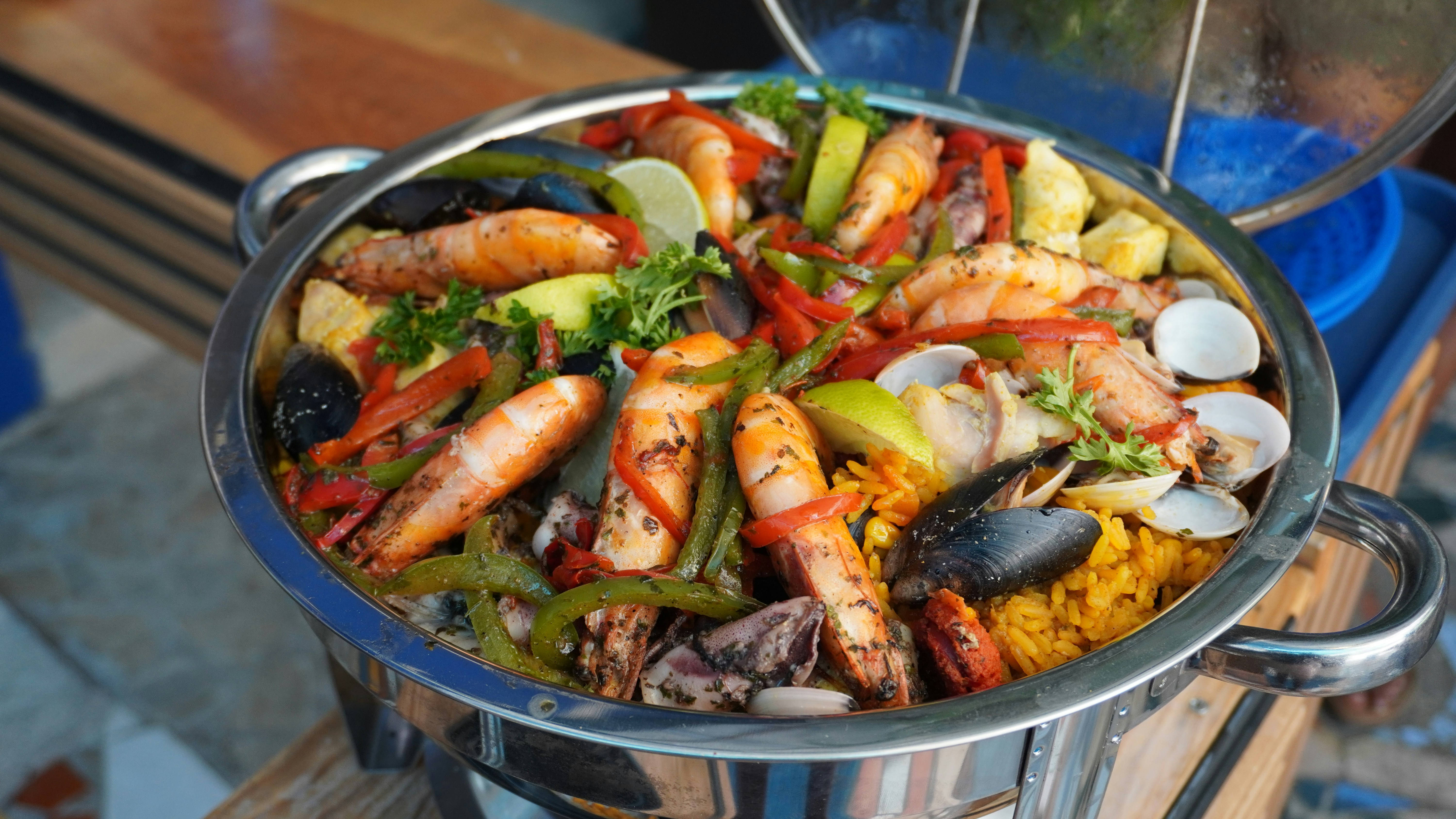 A large pan of seafood paella with shrimp and mussels