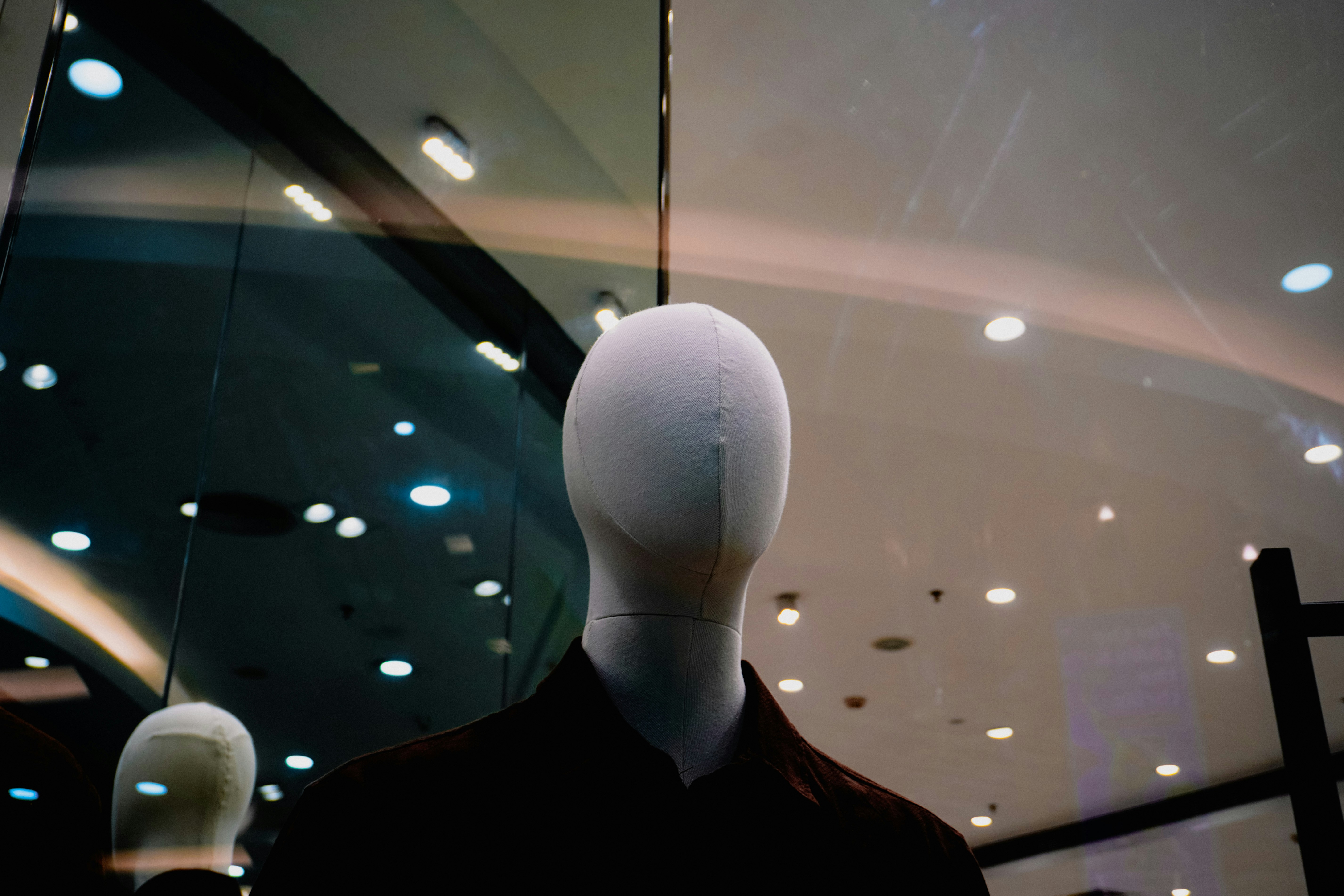 Mannequin head with blurred background lights