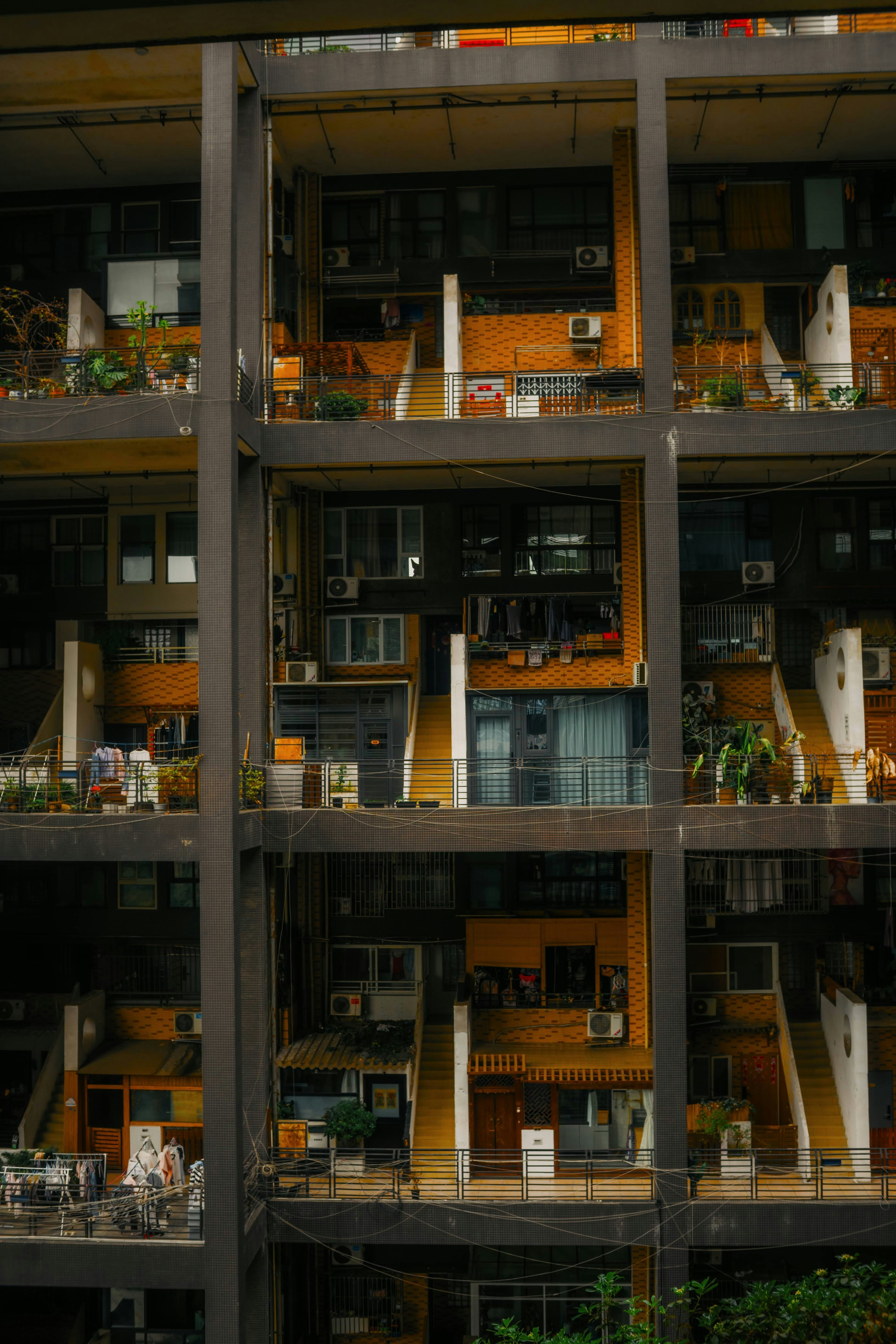 Apartment building with many balconies and windows