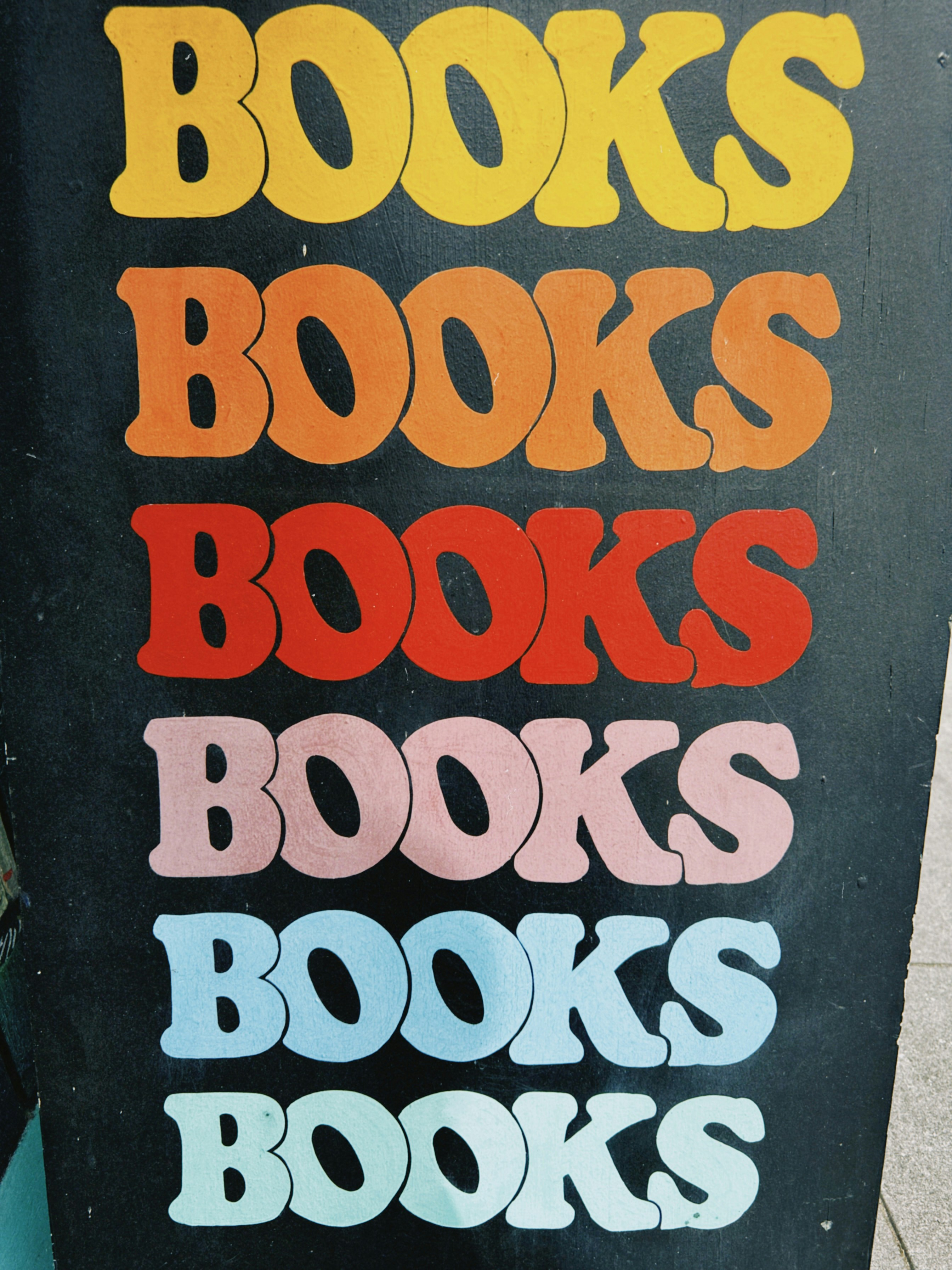 The word "books" repeated in colorful retro lettering.