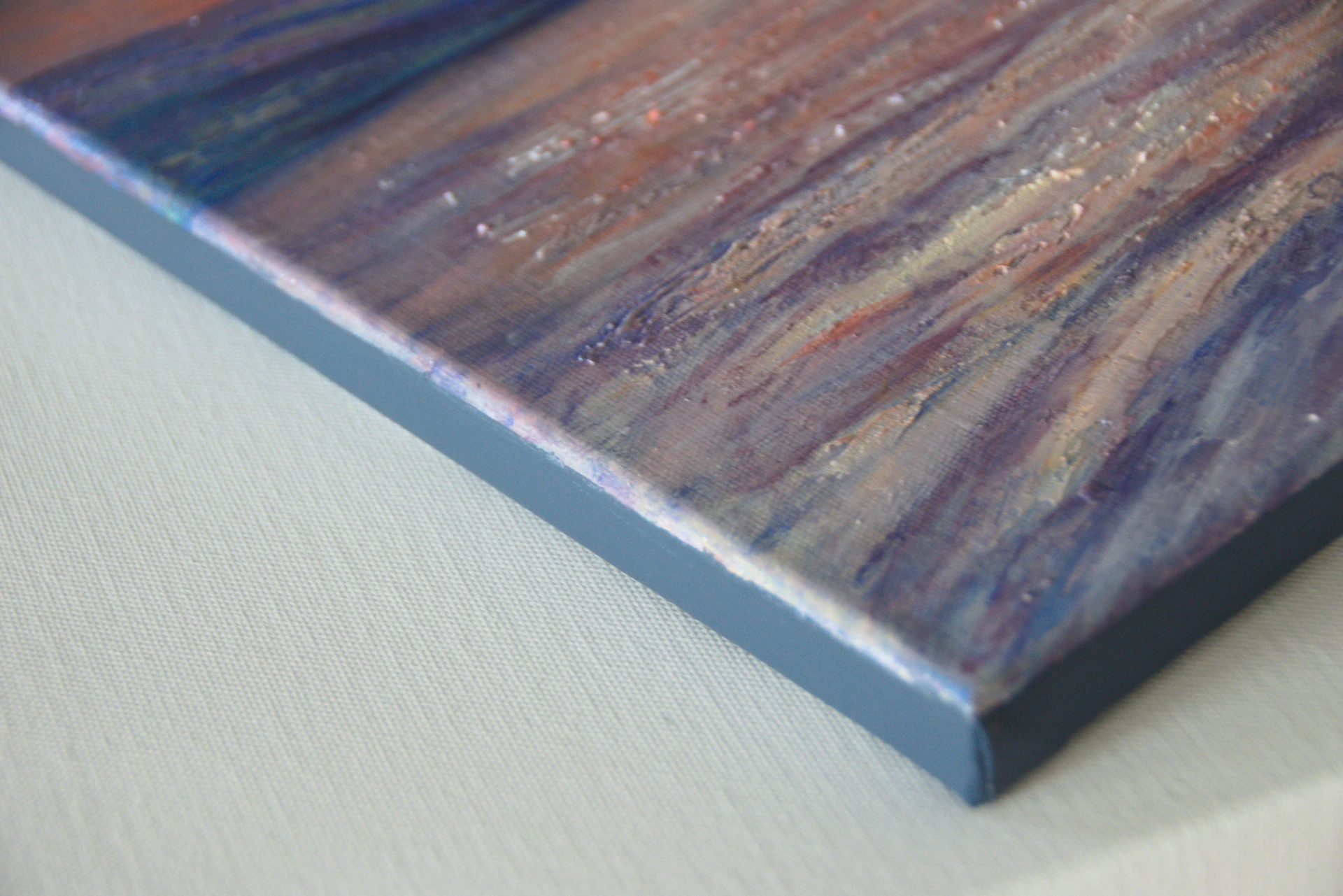 Abstract painting with textured purple and orange hues