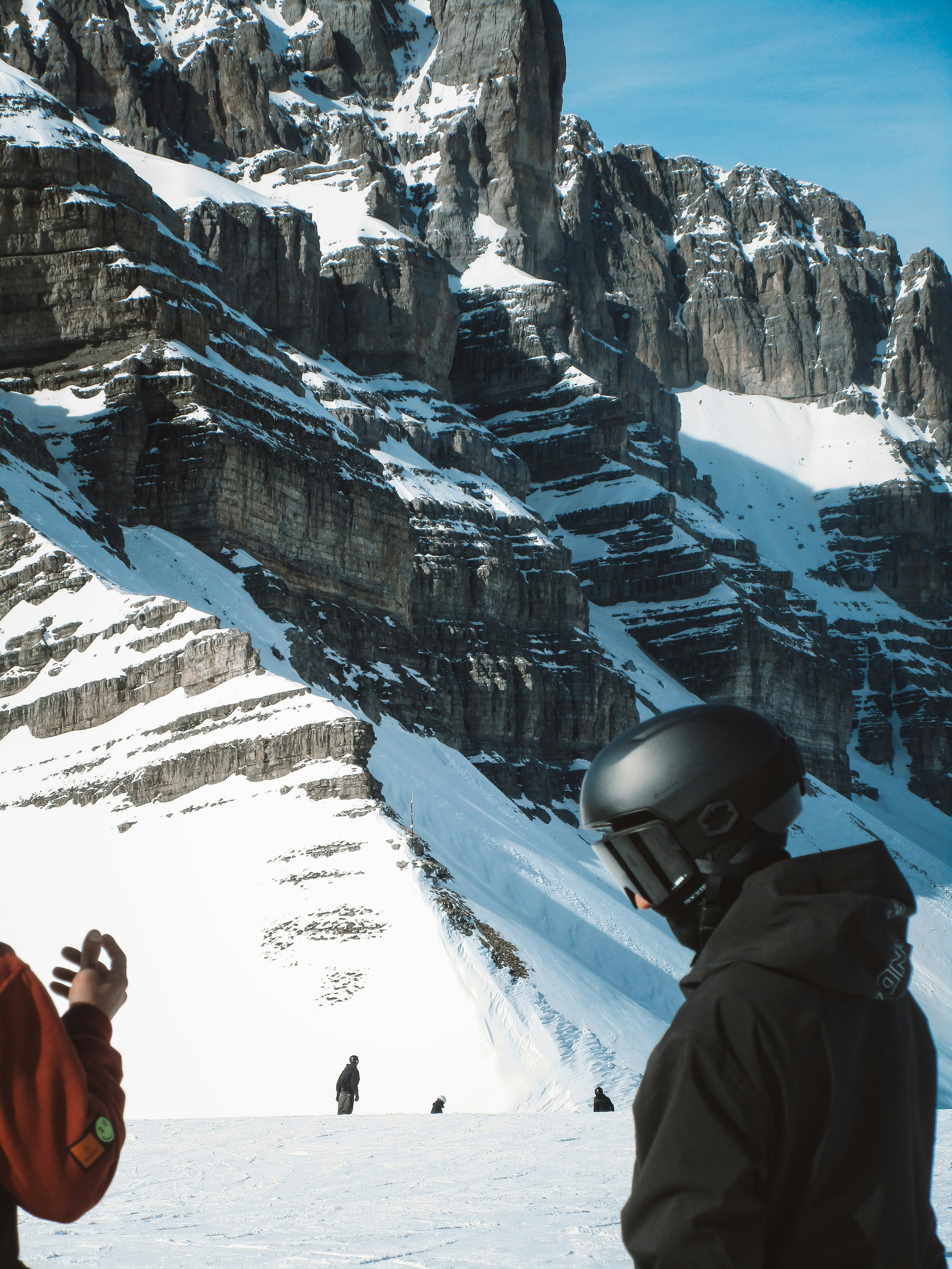 Skiers in a snowy mountain landscape