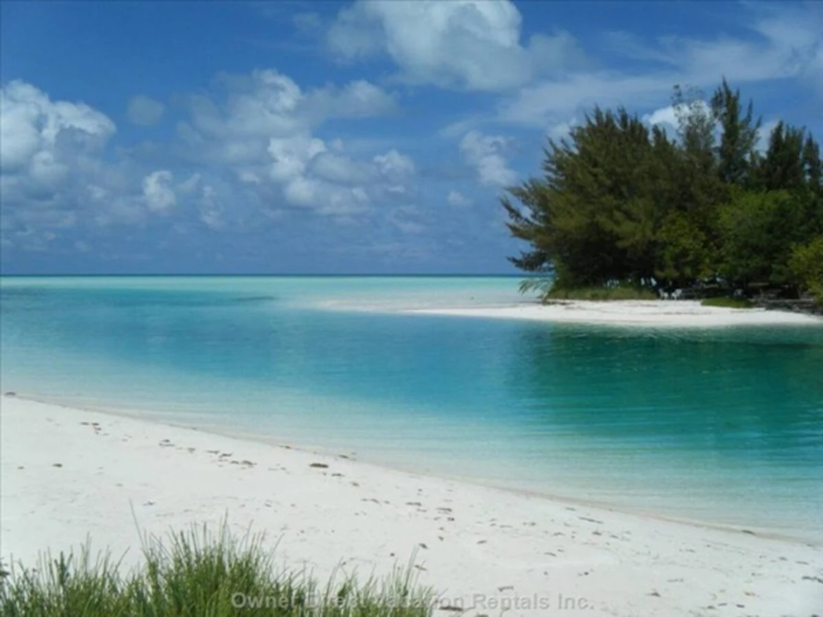 Turquoise water meeting a white sand beach