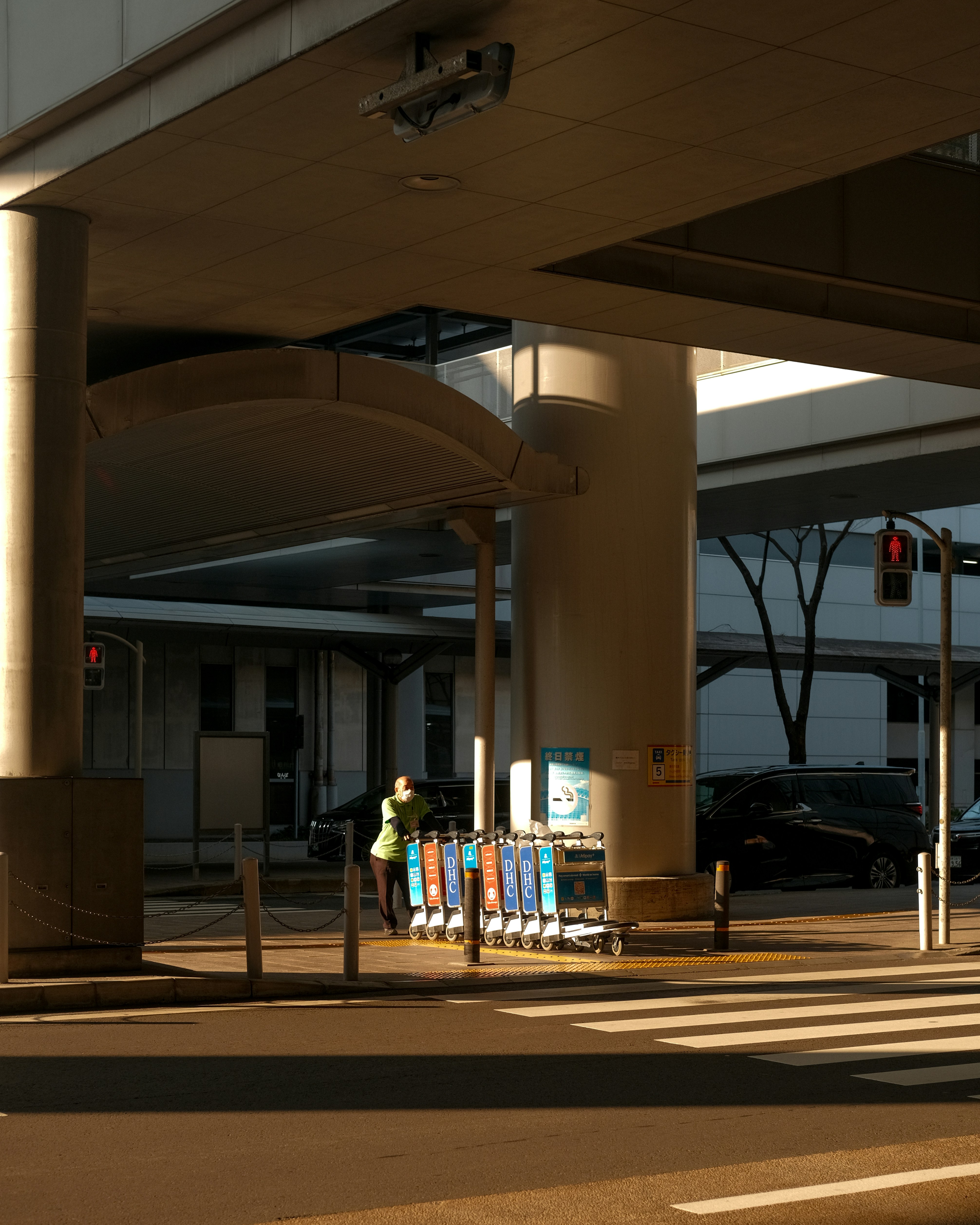 Image of a passenger entering a taxi at the airport terminal