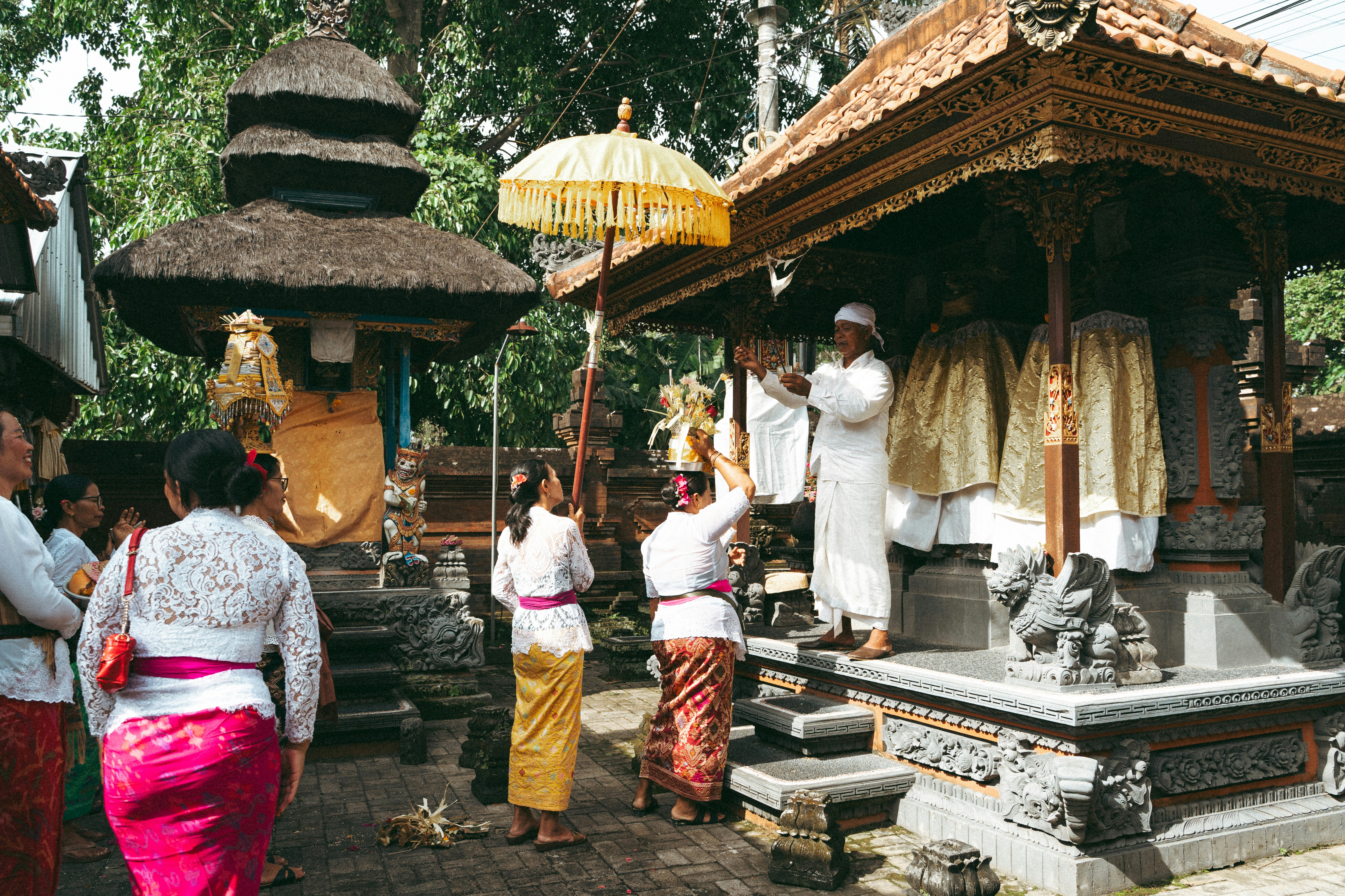 People in traditional clothing at a religious ceremony