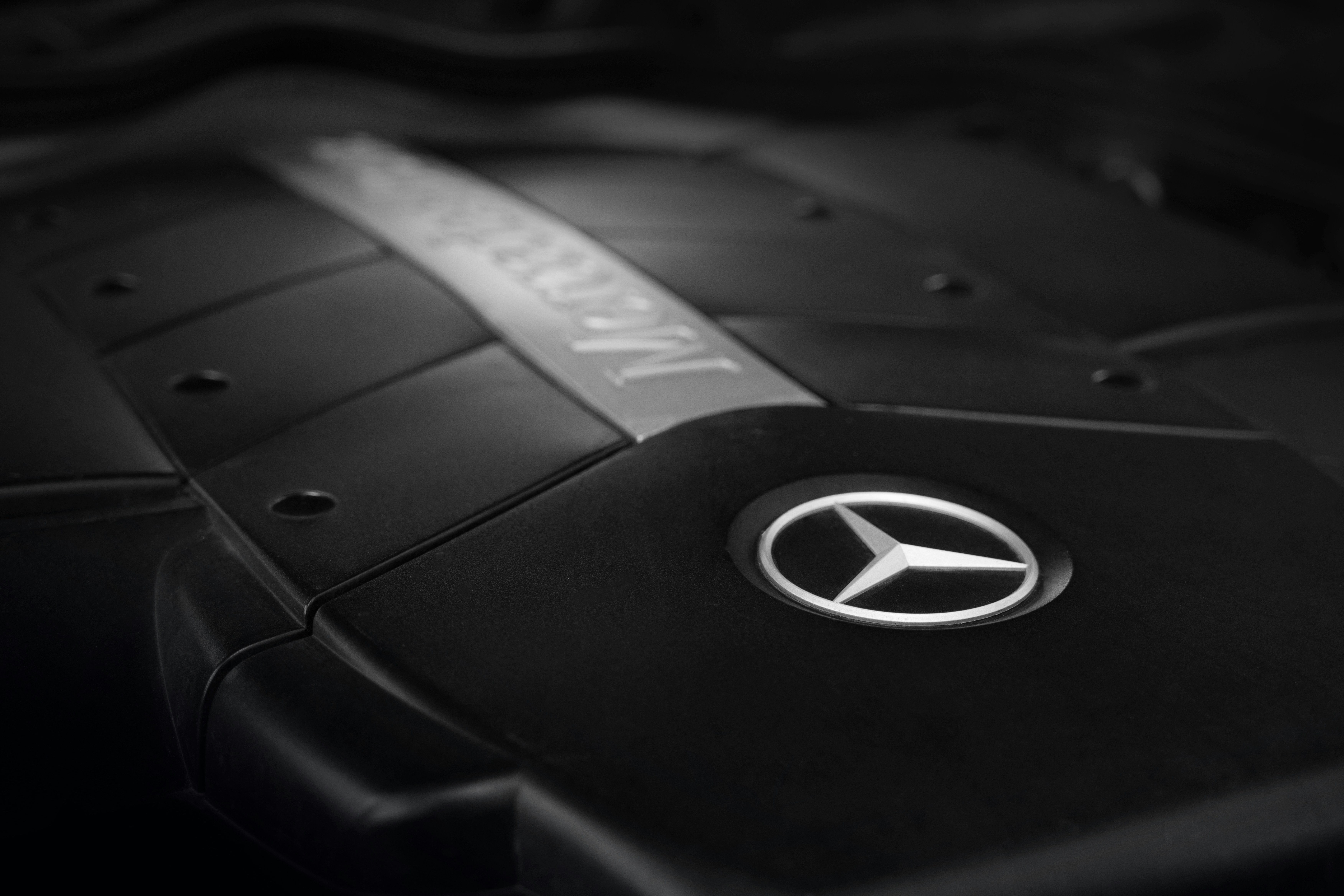Mercedes engine bay showing AC lines and compressor location - mercedes air conditioning service