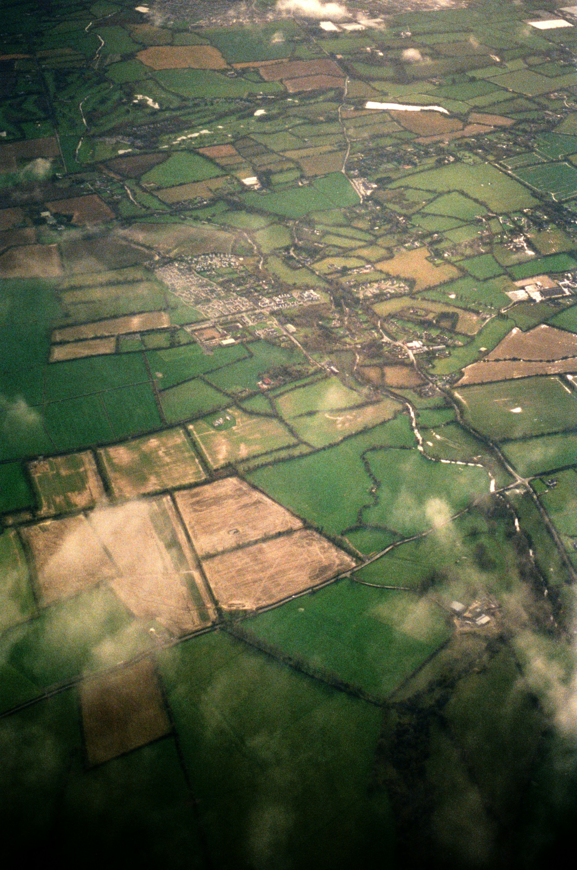 Patchwork farmland with scattered woodland